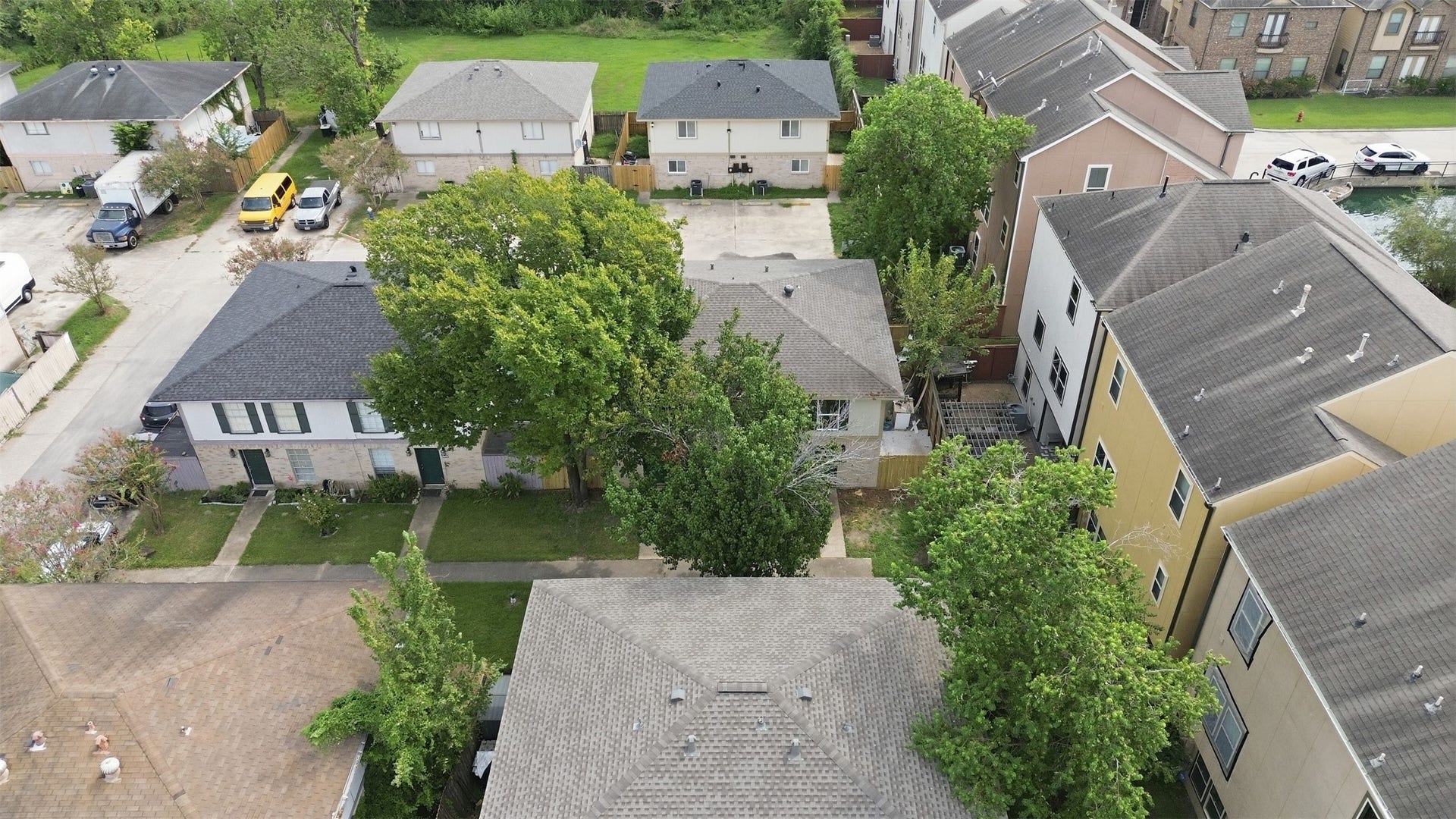 1936 Upland Drive, Houston, TX 77043 Charming neighborhood setting with a mix of well-maintained homes, lush greenery, and convenient access to local amenities.