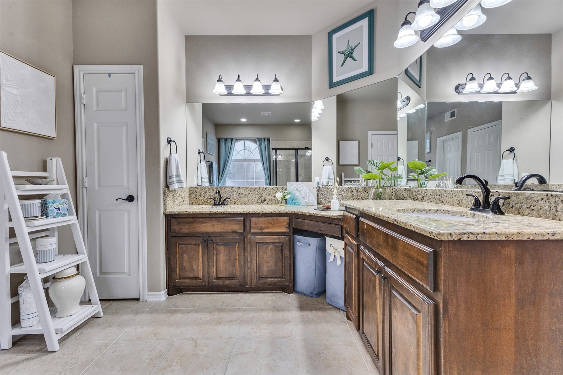Room for two! Separate vanities with granite countertops make busy mornings a little easier.