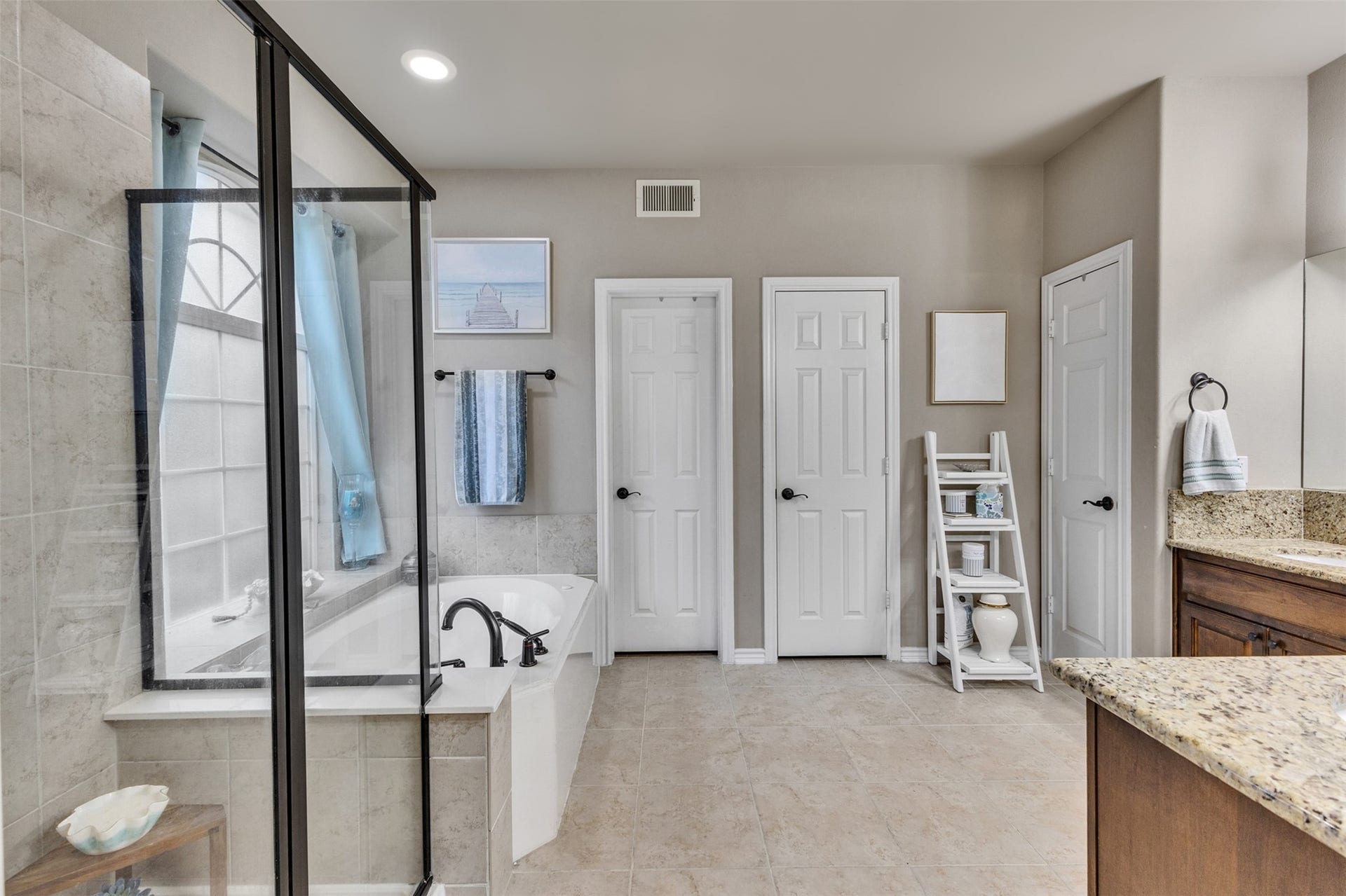 Your own personal spa experience! Unwind in the soaking tub or refresh in the separate glass-enclosed shower.