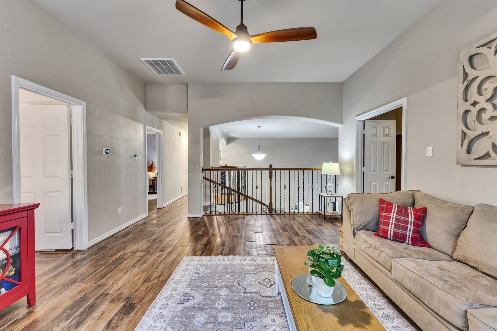 An open upstairs layout connects the game room to the surrounding bedrooms and media room, creating a comfortable space to gather.