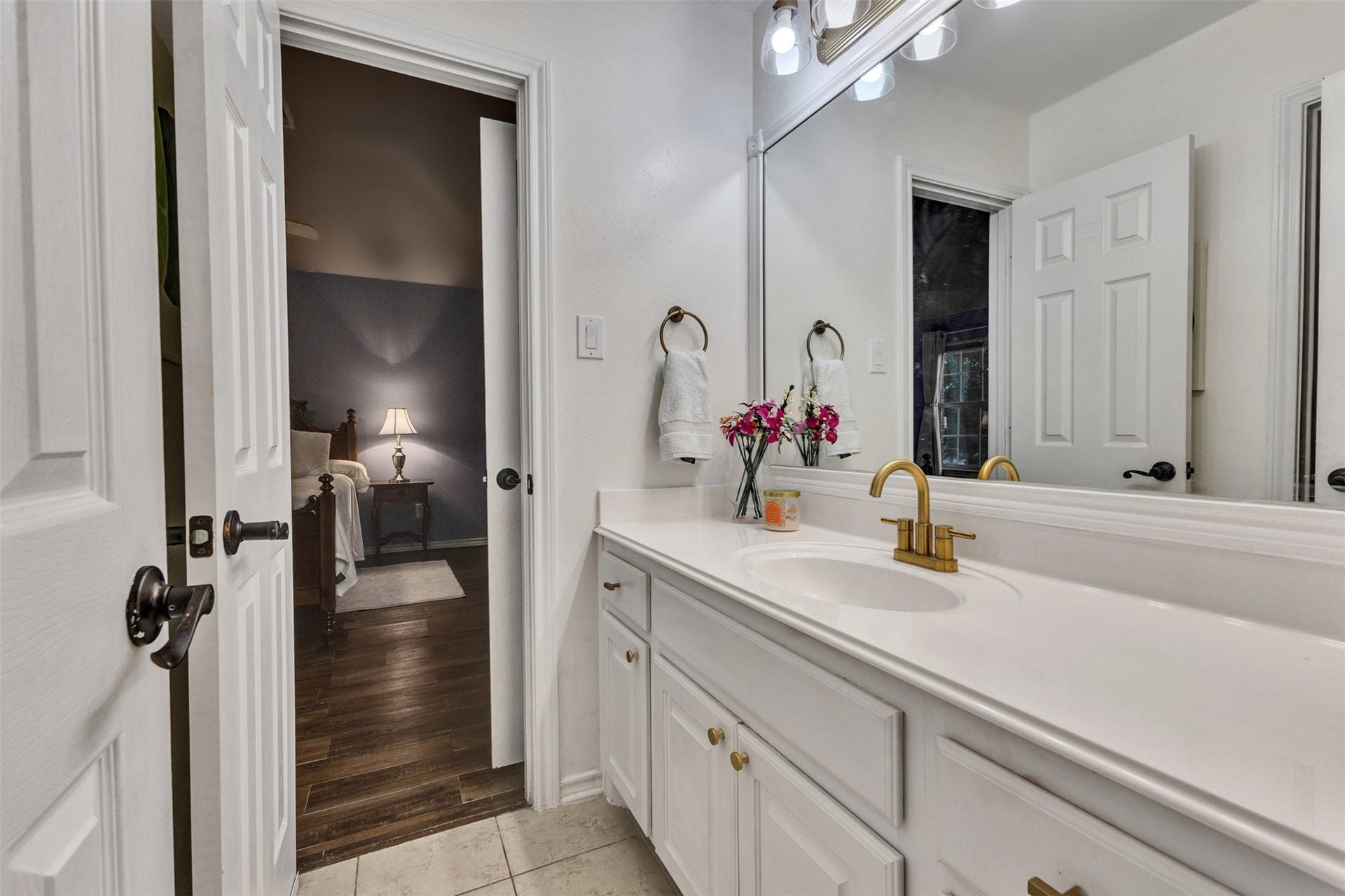 A convenient shared bathroom with a spacious vanity and separate access from the adjoining bedrooms.