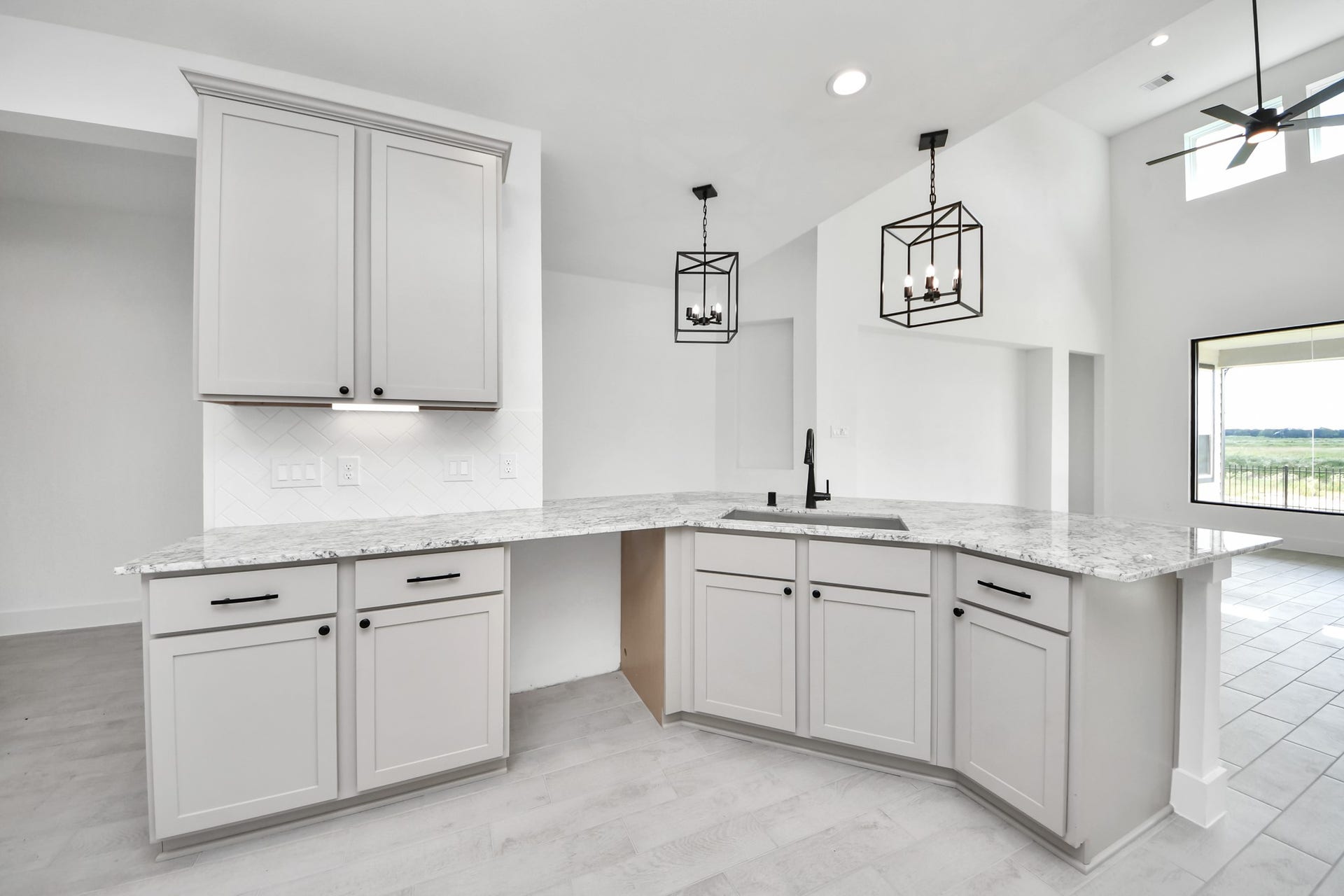 5914 Fox Peak Lane, Richmond, TX 77469 All of this overlooks your expansive family room, creating a perfect space for culinary delights and family gatherings. Sample photo of completed home with similar floor plan. Actual colors and selections may vary.