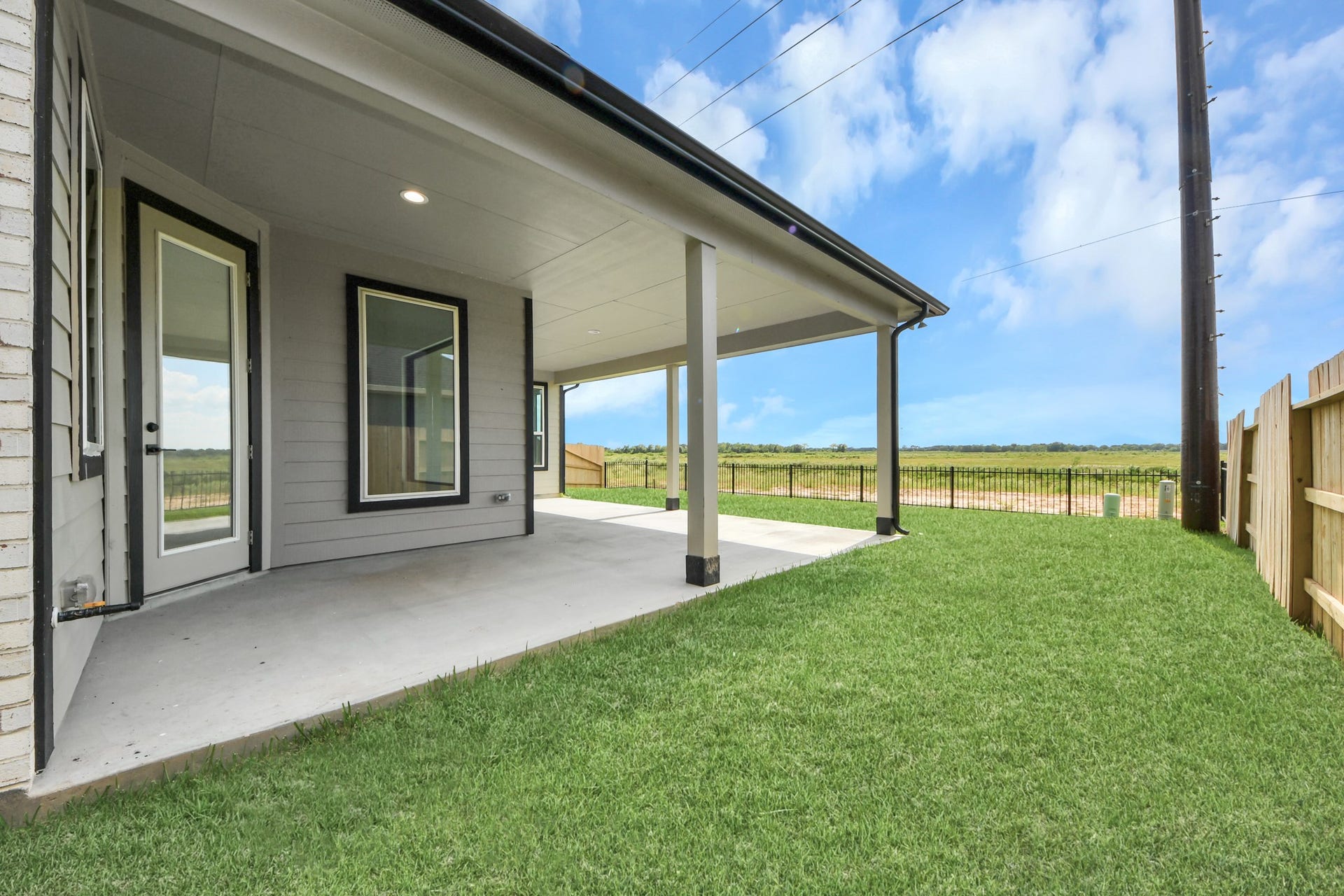 5914 Fox Peak Lane, Richmond, TX 77469 Experience outdoor living at its finest on this expansive covered patio, thoughtfully designed for BBQs and delightful outdoor dining. Sample photo of completed home with similar floor plan. Actual colors and selections may vary.