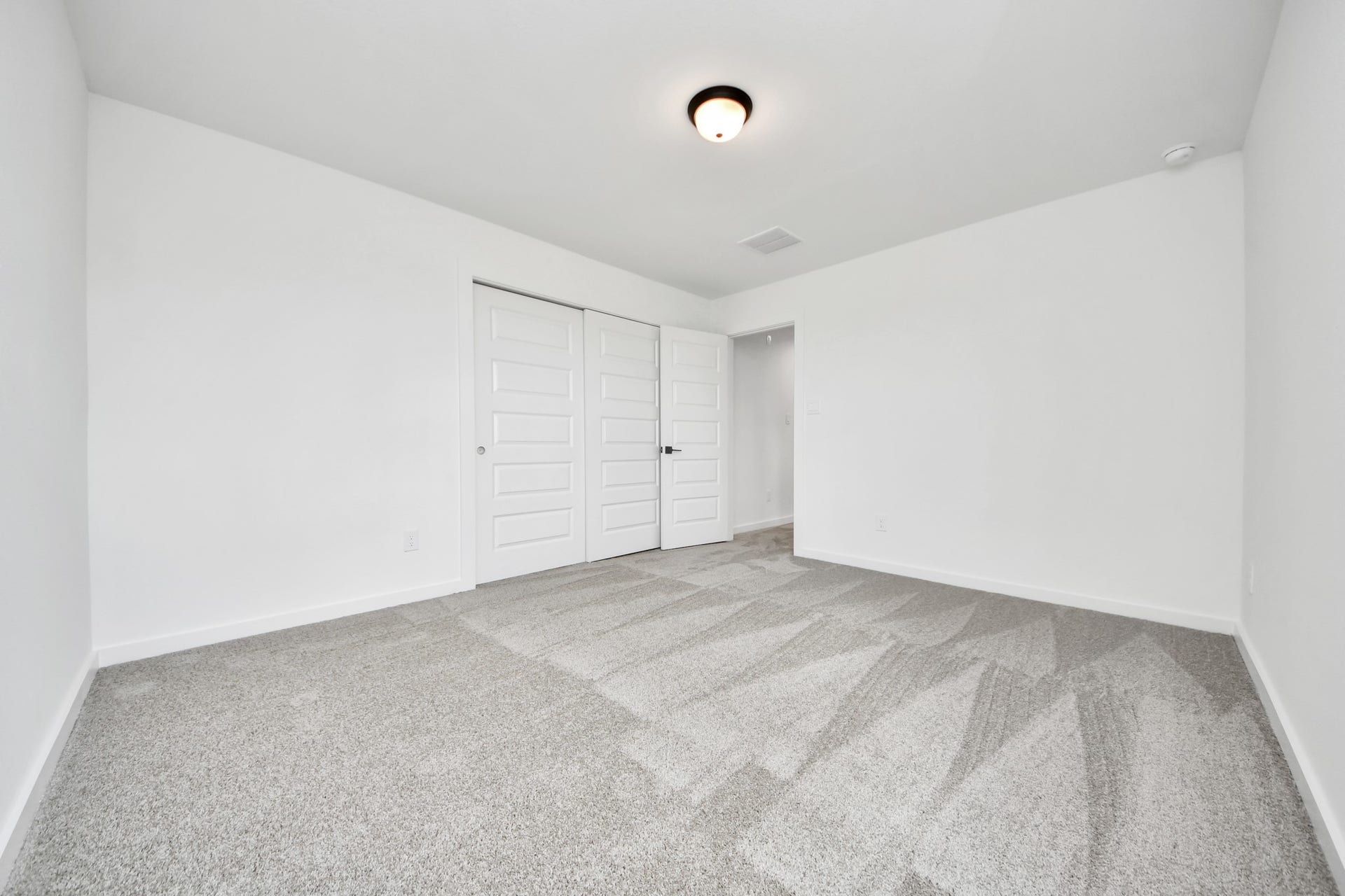 5914 Fox Peak Lane, Richmond, TX 77469 Generously sized secondary bedrooms featuring spacious closets, soft and inviting carpeting underfoot, large windows allowing plenty of natural light, and the added touch of privacy blinds for your personal retreat. Sample photo of completed home with similar floor plan. Actual colors and selections may vary.
