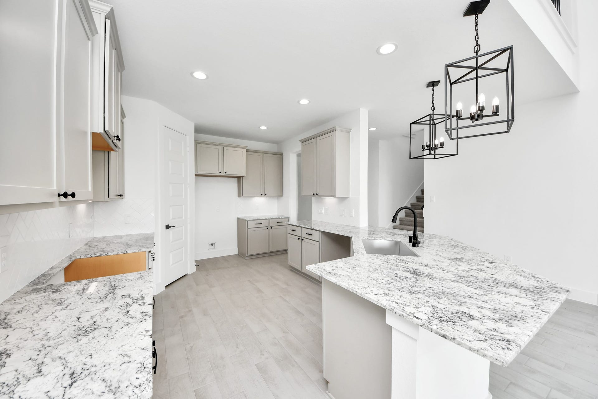 5914 Fox Peak Lane, Richmond, TX 77469 This generously spacious kitchen is a dream realized! Sample photo of completed home with similar floor plan. Actual colors and selections may vary.