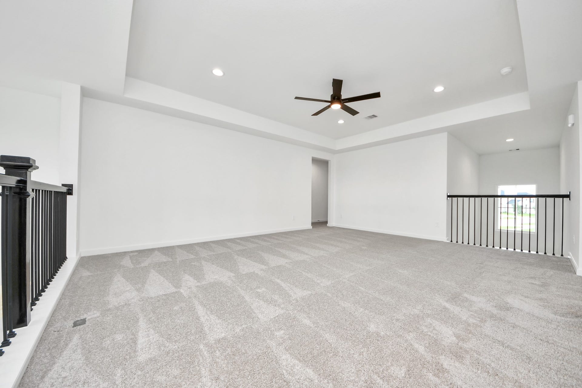 5914 Fox Peak Lane, Richmond, TX 77469 Come upstairs and enjoy a day of leisure in this fabulous game room! This is the perfect hangout spot or adult game room! Features plush carpet, high ceilings, custom paint and windows for plenty of natural light. Sample photo of completed home with similar floor plan. Actual colors and selections may vary.