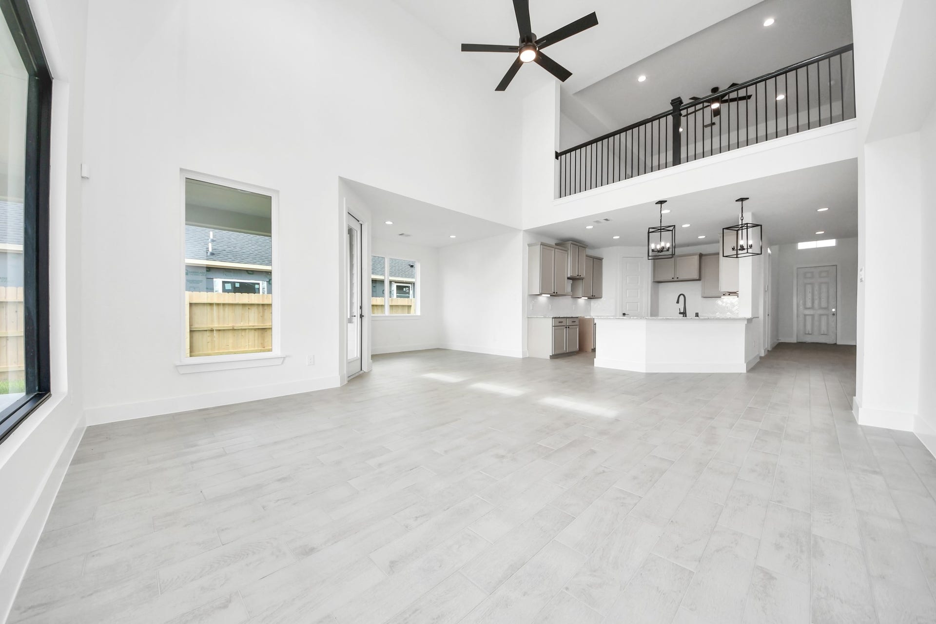 5914 Fox Peak Lane, Richmond, TX 77469 Take another glimpse into the heart of the home with this additional view of the family rooma sprawling space ready to accommodate all your gatherings. Sample photo of completed home with similar floor plan. Actual colors and selections may vary.