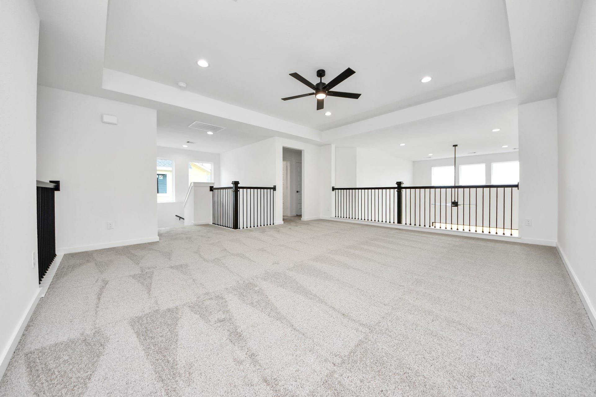 5914 Fox Peak Lane, Richmond, TX 77469 Ascend to relaxation in this fantastic game room! Ideal for both casual gatherings and adult gaming, it boasts plush carpet, lofty ceilings, custom paint, and ample windows for abundant natural light. Sample photo of completed home with similar floor plan. Actual colors and selections may vary.