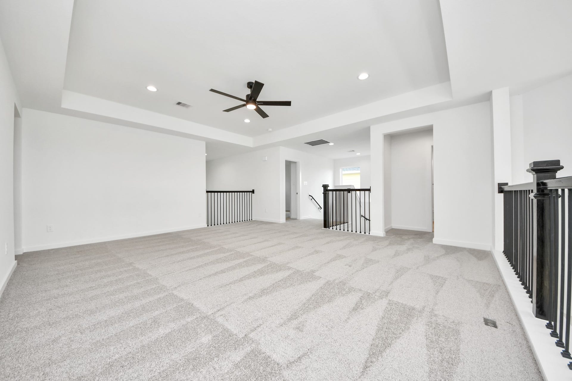 5914 Fox Peak Lane, Richmond, TX 77469 Discover a haven of leisure in this fantastic game room! Whether you're seeking a casual hangout or an adult gaming retreat, this space has it all. Enjoy the luxurious feel of plush carpet underfoot, the expansive ambiance of high ceilings, custom paint that adds a touch of personality, and windows that flood the room with refreshing natural light. Sample photo of completed home with similar floor plan. Actual colors and selections may vary.