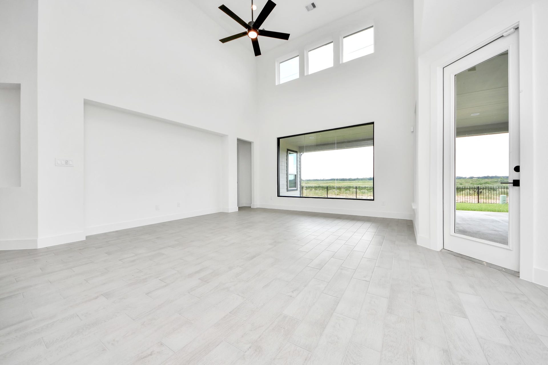 5914 Fox Peak Lane, Richmond, TX 77469 Welcome family and guests to your charming living room! With its high ceilings, recessed lighting, ceiling fan, custom paint, beautiful flooring, and large windows that let in abundant natural light, this room is perfect for gatherings. Sample photo of completed home with similar floor plan. Actual colors and selections may vary.