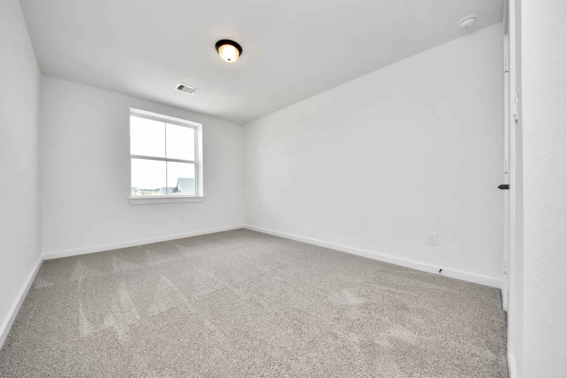5914 Fox Peak Lane, Richmond, TX 77469 Generously sized secondary bedrooms featuring spacious closets, soft and inviting carpeting underfoot, large windows allowing plenty of natural light, and the added touch of privacy blinds for your personal retreat. Sample photo of completed home with similar floor plan. Actual colors and selections may vary.