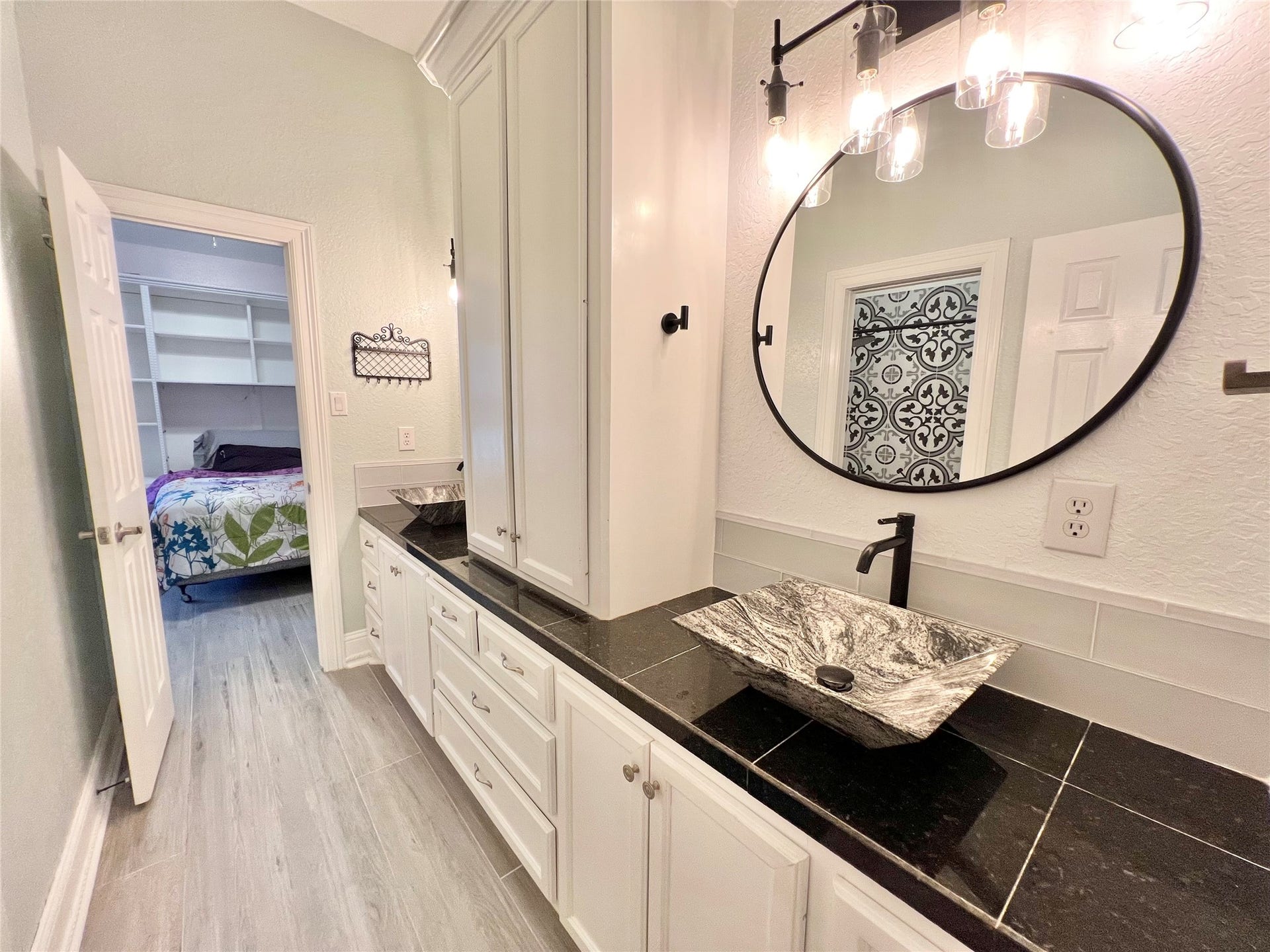 6714 Jay Road Road, Hitchcock, TX 77563 Jack and Jill oversized bathroom with 2 separate vanities as well as a private tub/shower room!