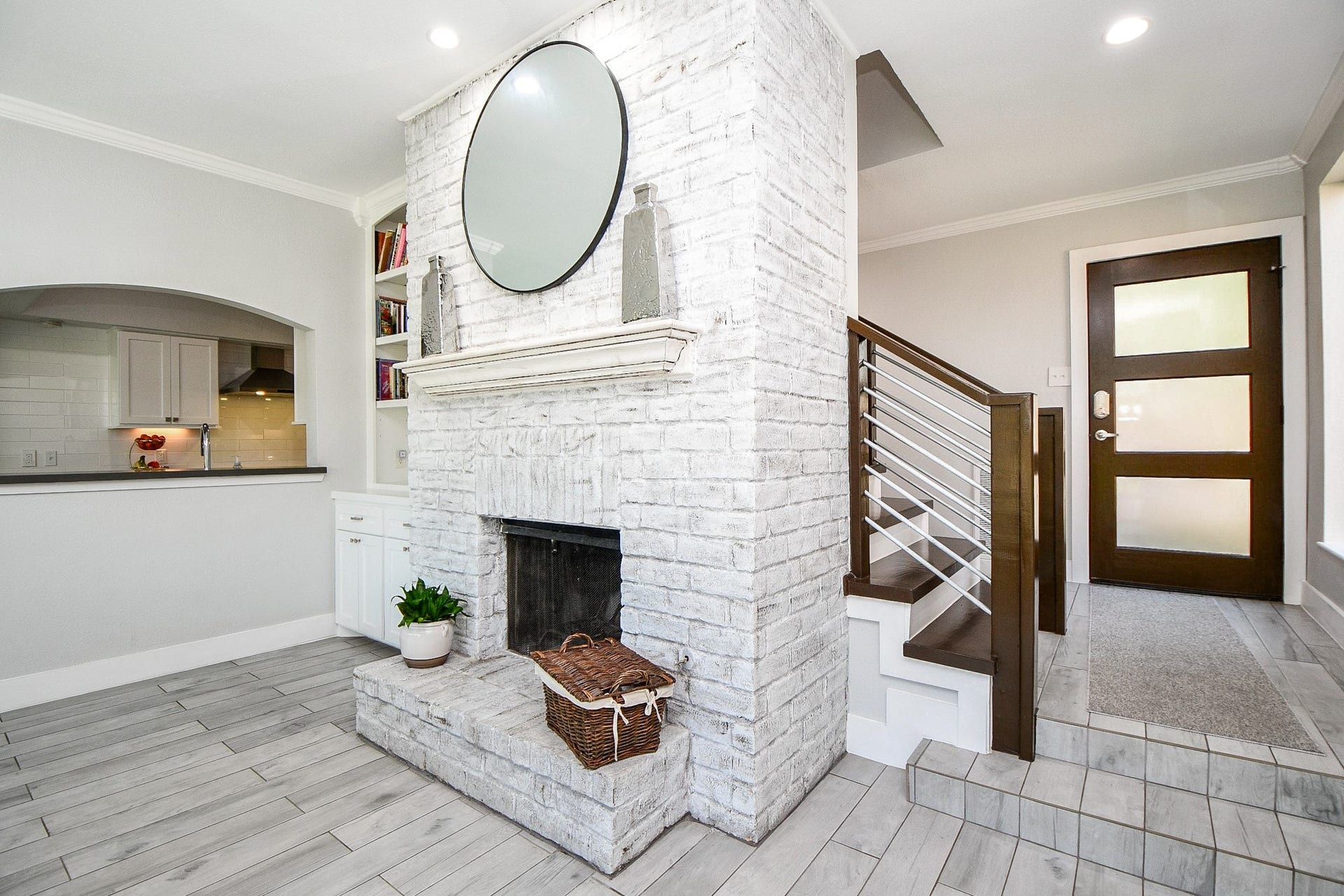 811 Bayou River Drive, Houston, TX 77079 The whitewashed brick fireplace has a raised hearth and wood-burning firebox.