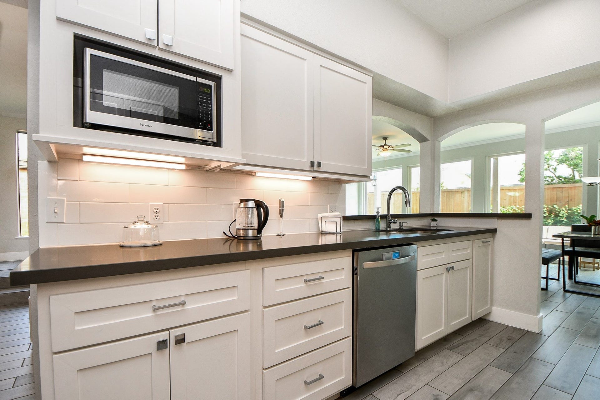 811 Bayou River Drive, Houston, TX 77079 The kitchen has a vent hood, ample counter space, and a pass-through to the living room.