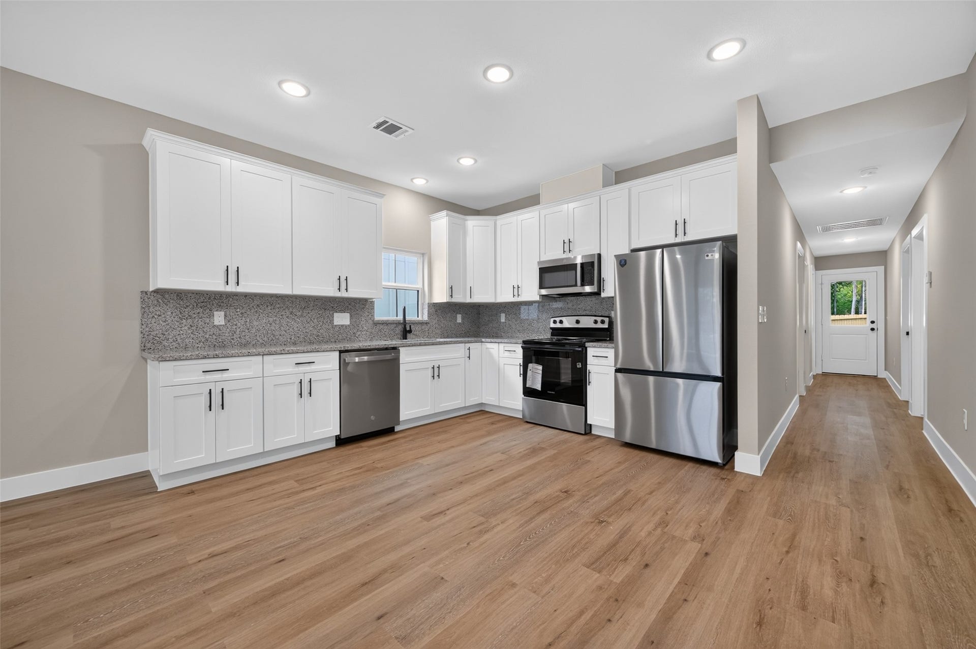 1060 Mann Road, #A, Conroe, TX 77303 Kitchen comes with brand new refrigerator.