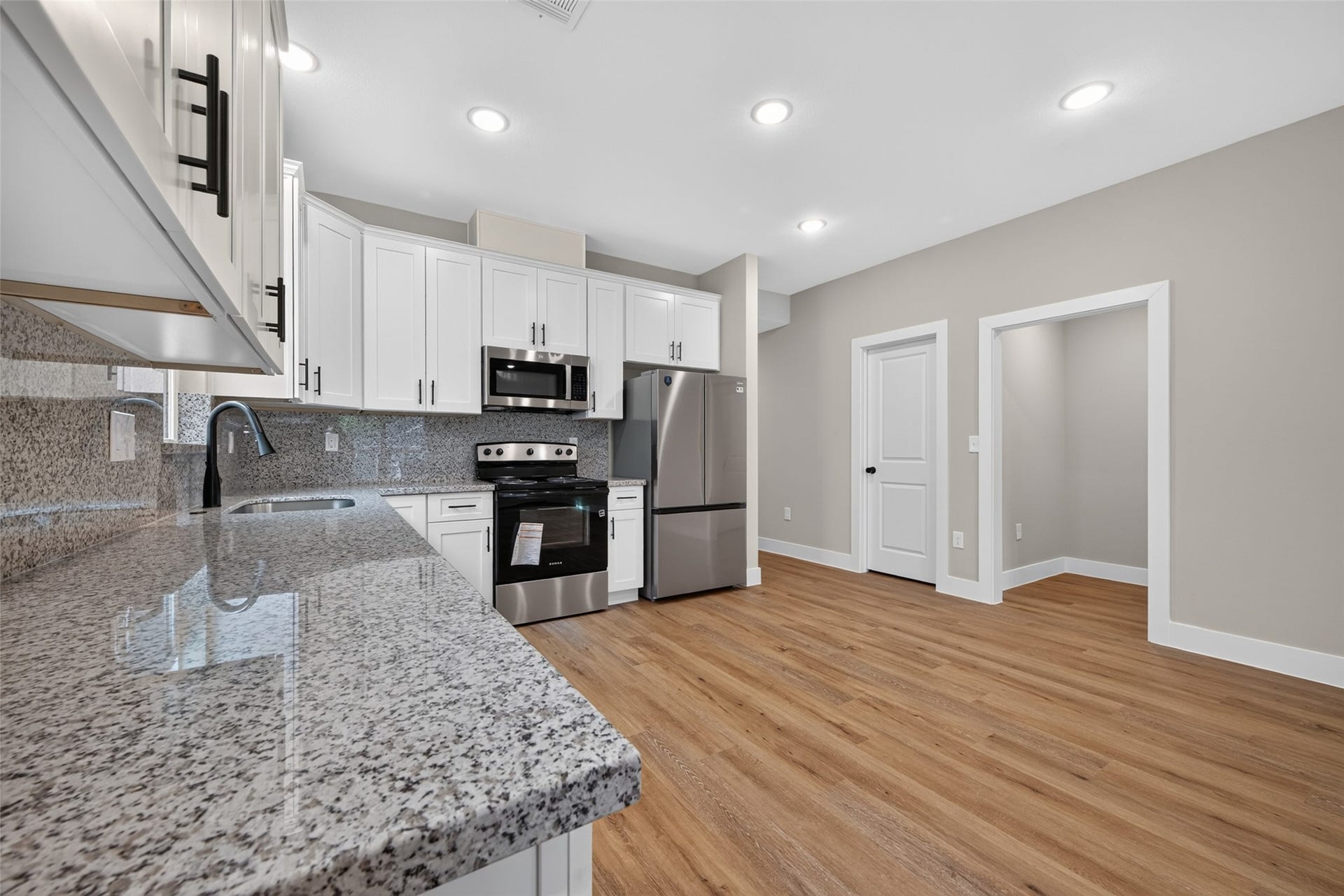 1060 Mann Road, #A, Conroe, TX 77303 Pantry and garage entrance is next to the kitchen.