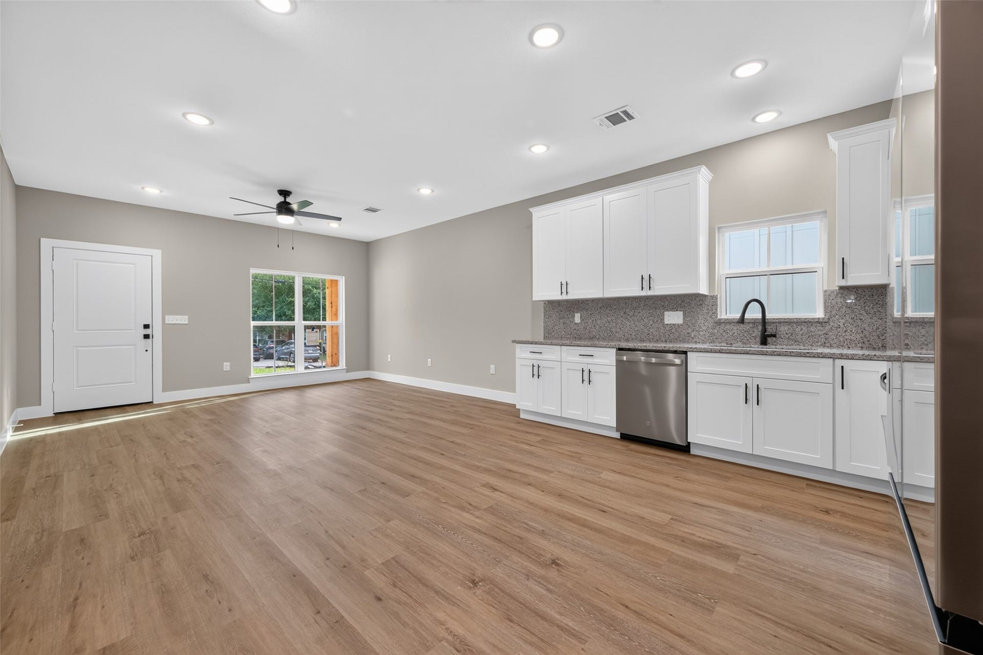 1060 Mann Road, #A, Conroe, TX 77303 Open concept living, dining, and kitchen space.