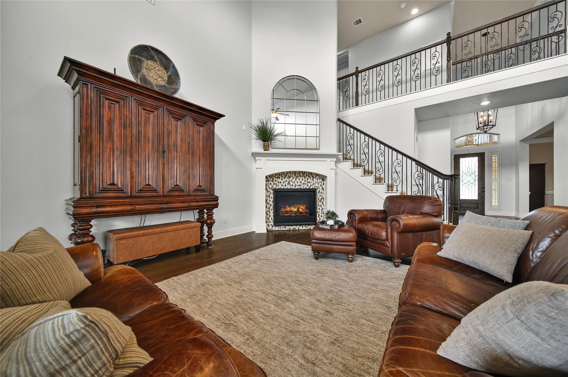 27707 Lakeway Trail Lane, Fulshear, TX 77441 The gas log fireplace serves as a beautiful focal point, adding warmth, character, and an inviting ambiance to the room.
