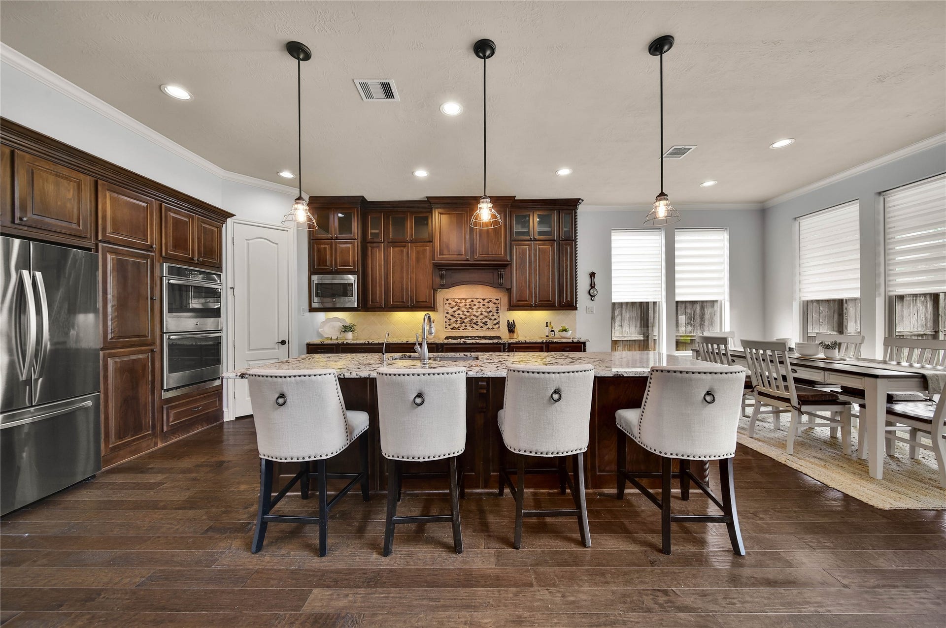 27707 Lakeway Trail Lane, Fulshear, TX 77441 This gourmet kitchen with an oversized center island is every chefs dream, offering an abundance of space for meal preparation, entertaining, and gathering with family and friends.
