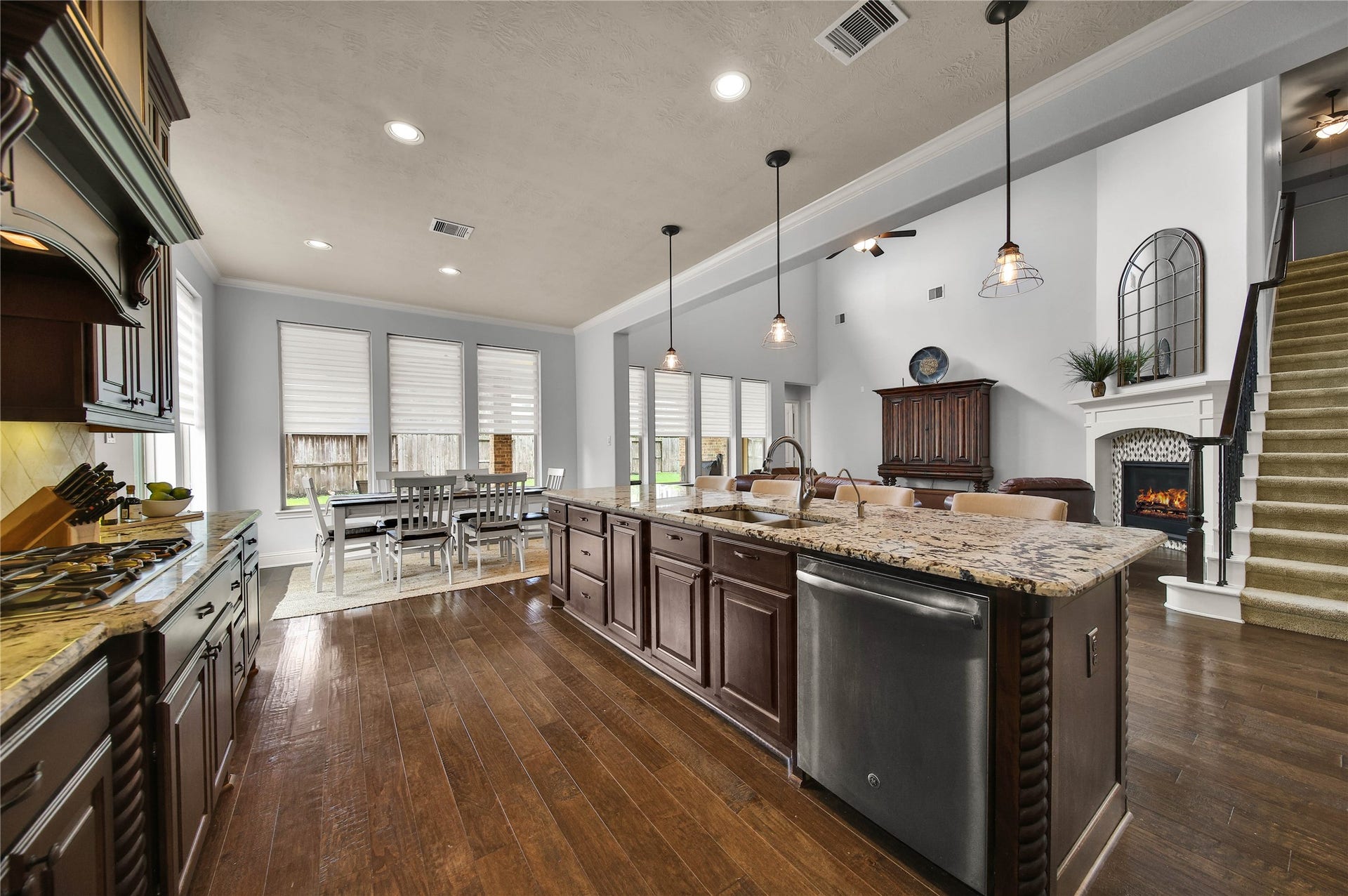 27707 Lakeway Trail Lane, Fulshear, TX 77441 The kitchen opens seamlessly to the living room, allowing the chef to stay connected and feel like part of the action while entertaining.