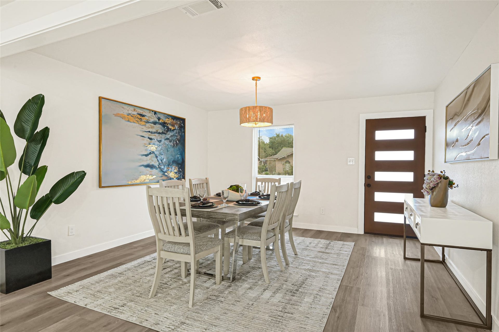 11102 Sagecanyon Drive, Houston, TX 77089 Inviting dining area featuring modern lighting, updated flooring, and plenty of natural light.