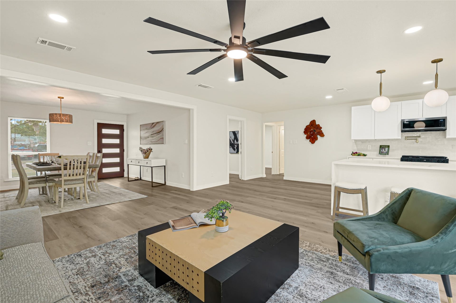 11102 Sagecanyon Drive, Houston, TX 77089 Bright and spacious open-concept living area seamlessly connecting the kitchen and dining space, perfect for everyday living and entertaining.