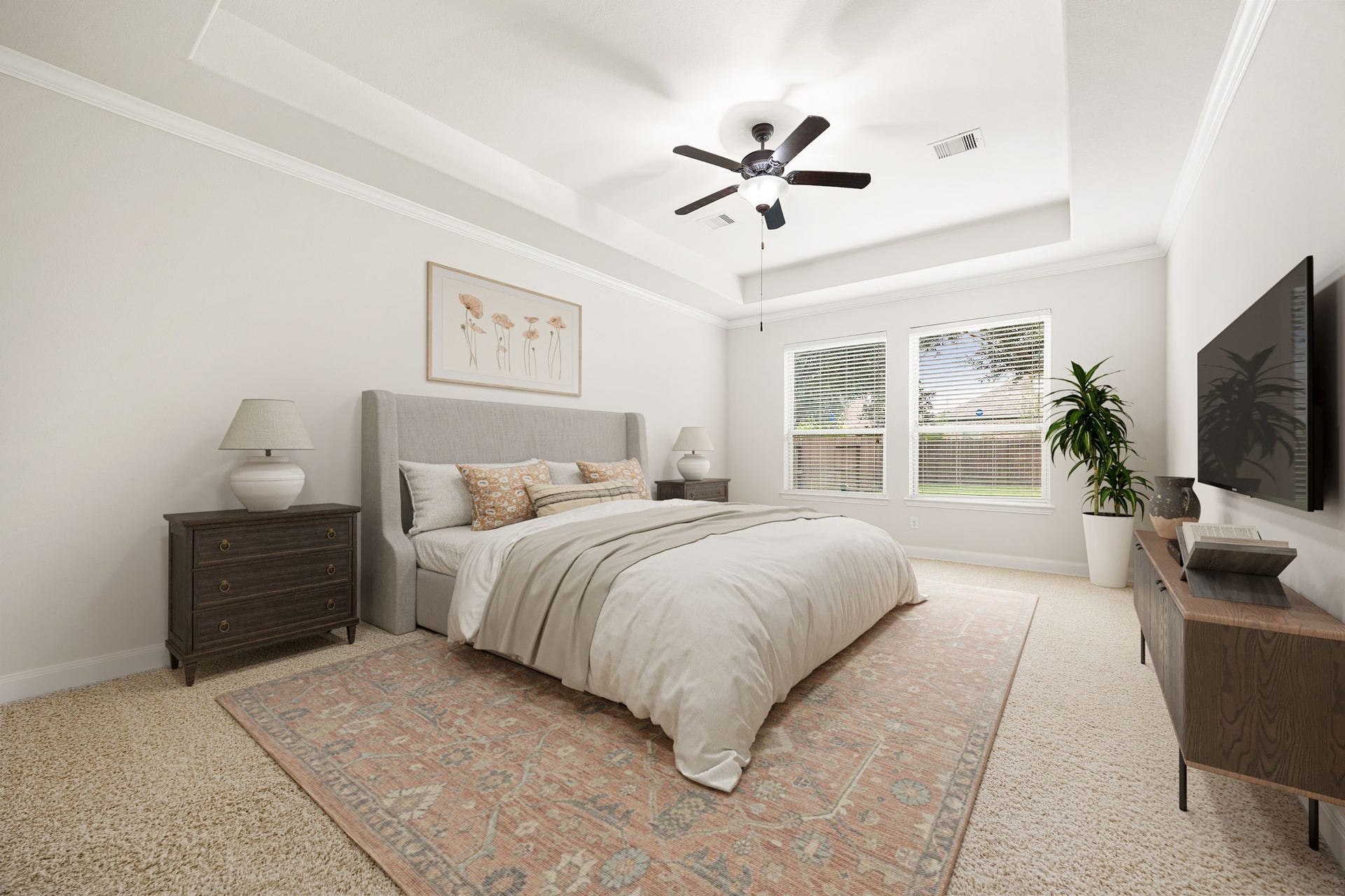 9931 Hutton Park Drive, Katy, TX 77494 This expansive primary bedroom suite features an elegant double-recessed tray ceiling accented by elegant crown molding and a central ceiling fan. Crisp neutral walls and large dual windows fill the space with a soft, inviting glow, creating a peaceful sanctuary away from the main living zones.