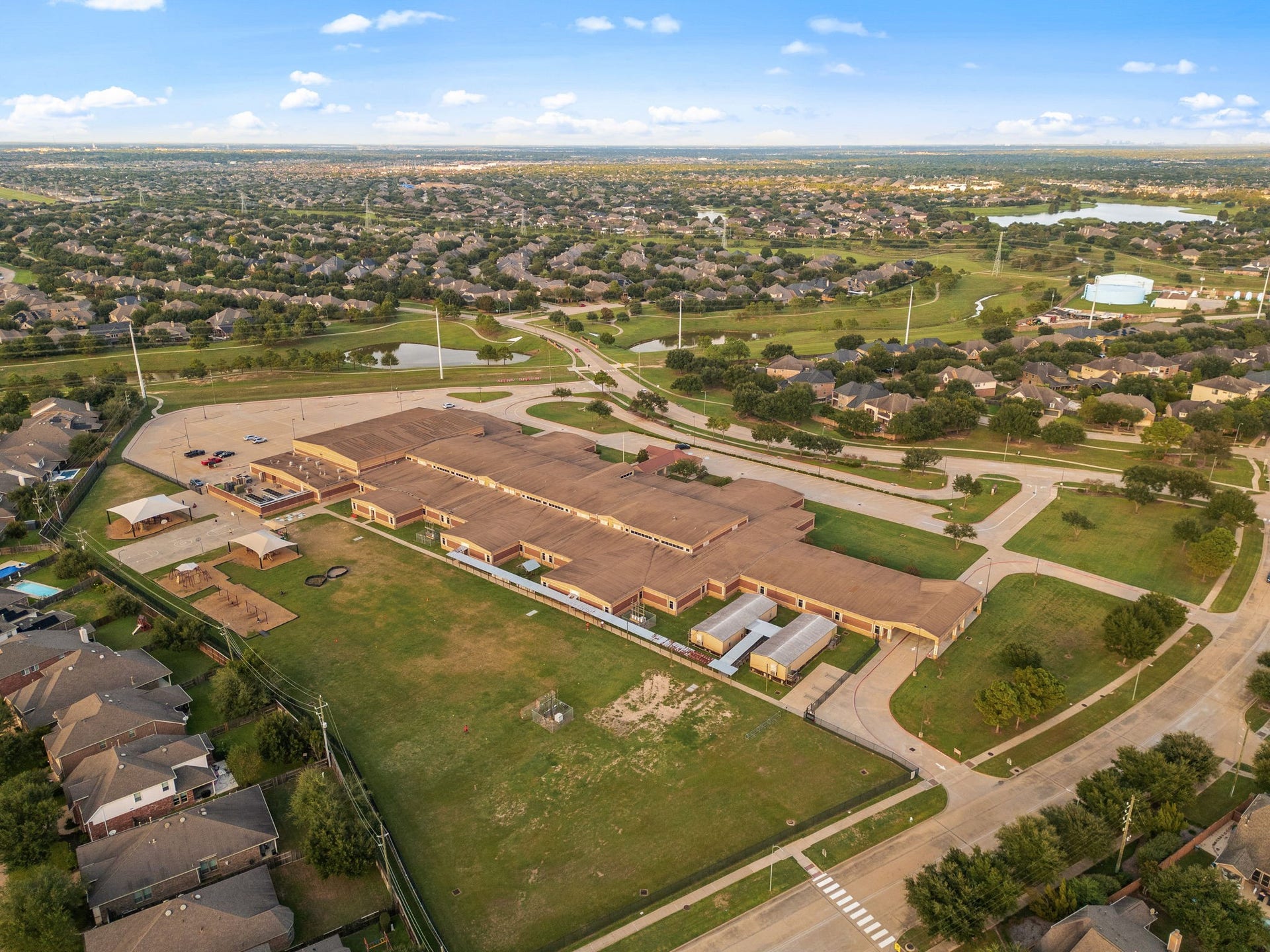 9931 Hutton Park Drive, Katy, TX 77494 This incredible aerial perspective highlights the home's premier proximity to Fred & Patti Shafer Elementary School, one of the top-rated campuses in the highly acclaimed Katy ISD. Nestled safely inside the master-planned neighborhood of Cinco Ranch Southwest, this stellar location offers families the ultimate convenience of short morning commutes, walking paths, and excellent community amenities right at their doorstep.