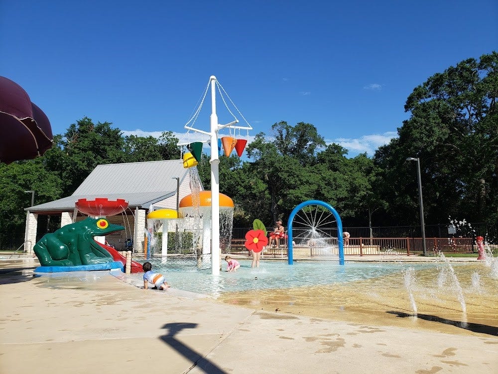 9931 Hutton Park Drive, Katy, TX 77494 This vibrant photo highlights the incredible community splash pad and water park features available to residents within the master-planned neighborhood. Complete with dump buckets, water slides, interactive spray features, and a shaded pavilion, this stellar amenity brings vacation-style living right to your community.