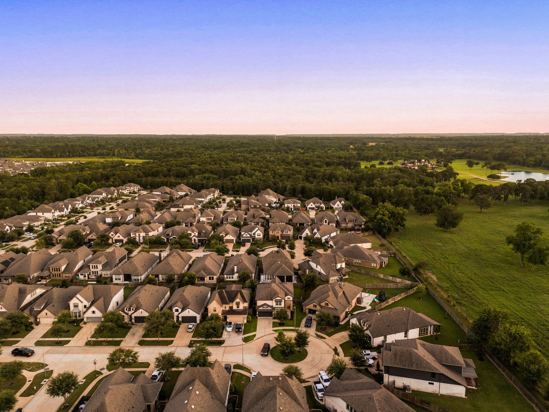 30715 Parkside Passage Drive, Fulshear, TX 77441 The incredible positioning ensures unparalleled backyard privacy, combining peaceful country-like vistas with the benefits of a premier neighborhood layout.