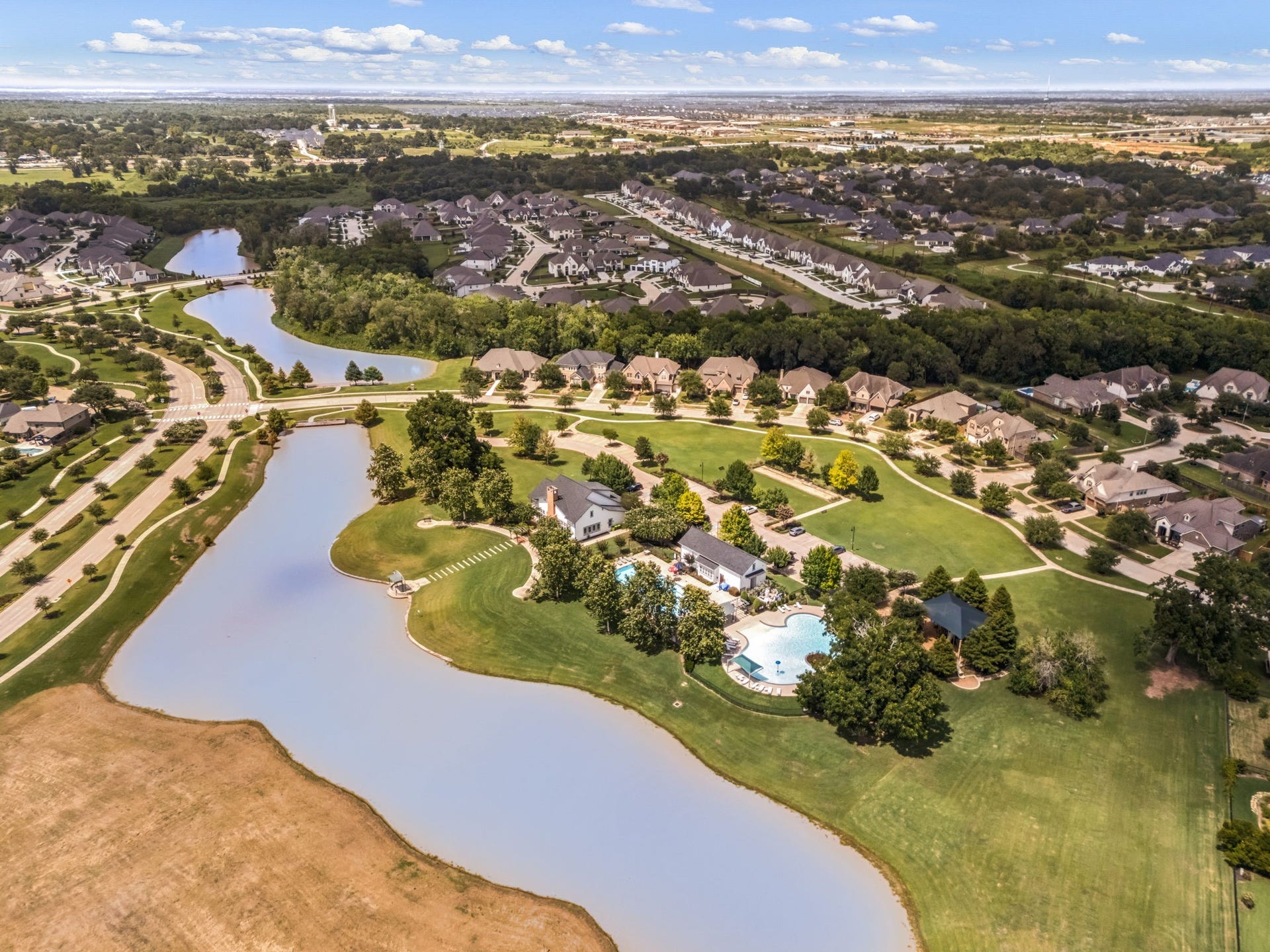 30715 Parkside Passage Drive, Fulshear, TX 77441 See how the beautifully designed neighborhood flows seamlessly around winding waterways, scenic walking trails, and the central resort-style amenity complex. A truly spectacular setting to call home.
