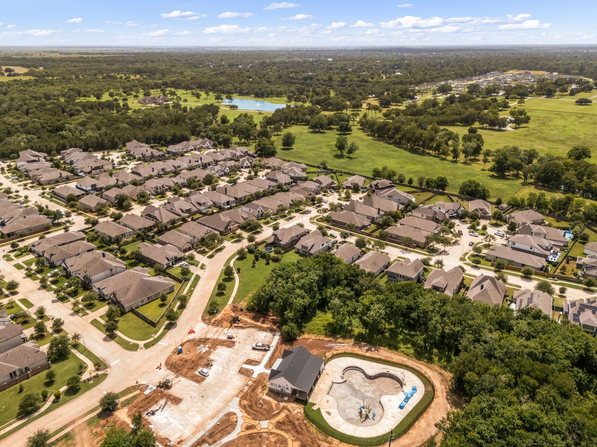 30715 Parkside Passage Drive, Fulshear, TX 77441 Future fun right outside your door! Check out the brand-new community pool currently under construction, just a short walk from your front porch.