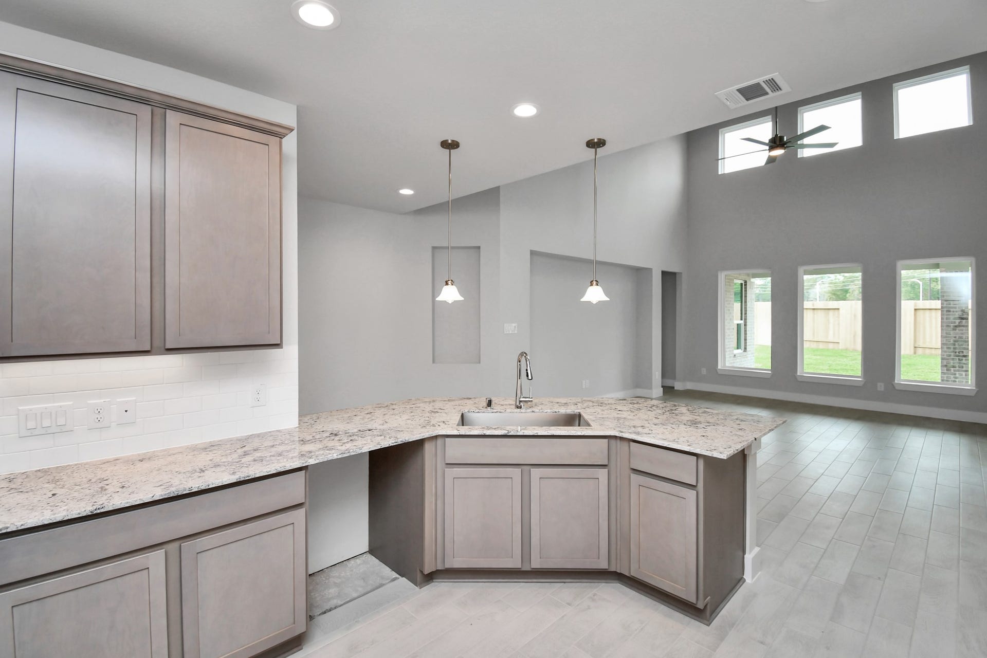 The extended counter area adds both practicality and style, making meal preparation a breeze. Every detail is thoughtfully designed to enhance the kitchen's functionality and aesthetic appeal. Sample photo of completed home with similar floor plan. Actual colors and selections may vary.