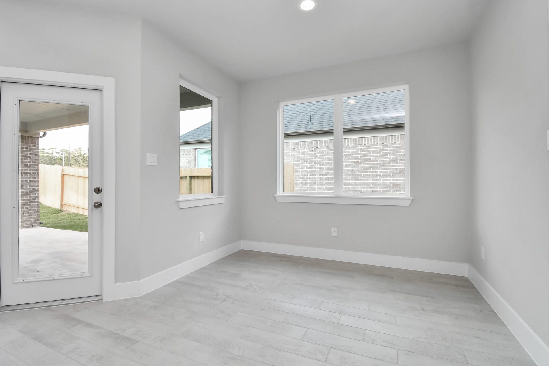 Enjoy breakfast with ease in the connected and cozy breakfast area, seamlessly integrated with the kitchen for utmost convenience. Step through the back door for a breath of fresh air onto the covered patio, extending your living space to the outdoors. Sample photo of completed home with similar floor plan. Actual colors and selections may vary.
