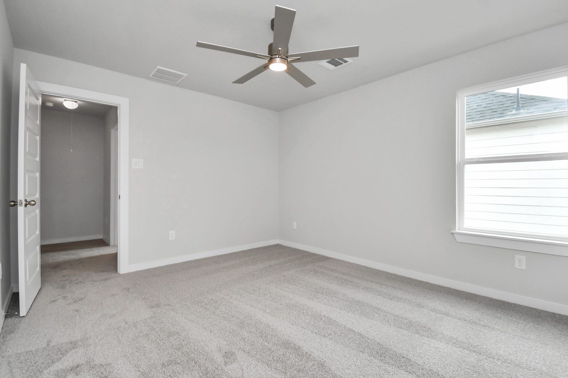 Generously sized secondary bedrooms featuring spacious closets, soft and inviting carpeting underfoot, large windows allowing plenty of natural light, and the added touch of privacy blinds for your personal retreat. Sample photo of completed home with similar floor plan. Actual colors and selections may vary.