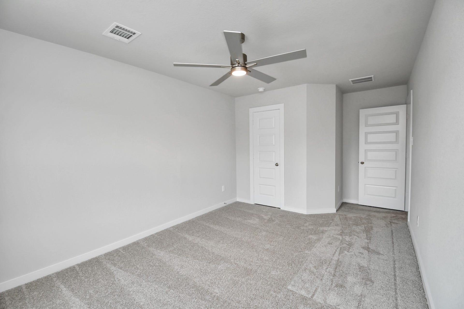Generously sized secondary bedrooms featuring spacious closets, soft and inviting carpeting underfoot, large windows allowing plenty of natural light, and the added touch of privacy blinds for your personal retreat. Sample photo of completed home with similar floor plan. Actual colors and selections may vary.