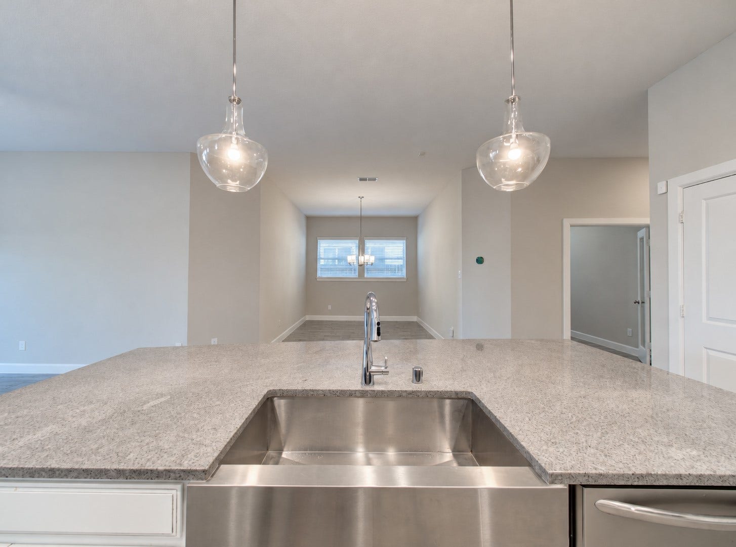 Large stainless steel sink with quartz countertop