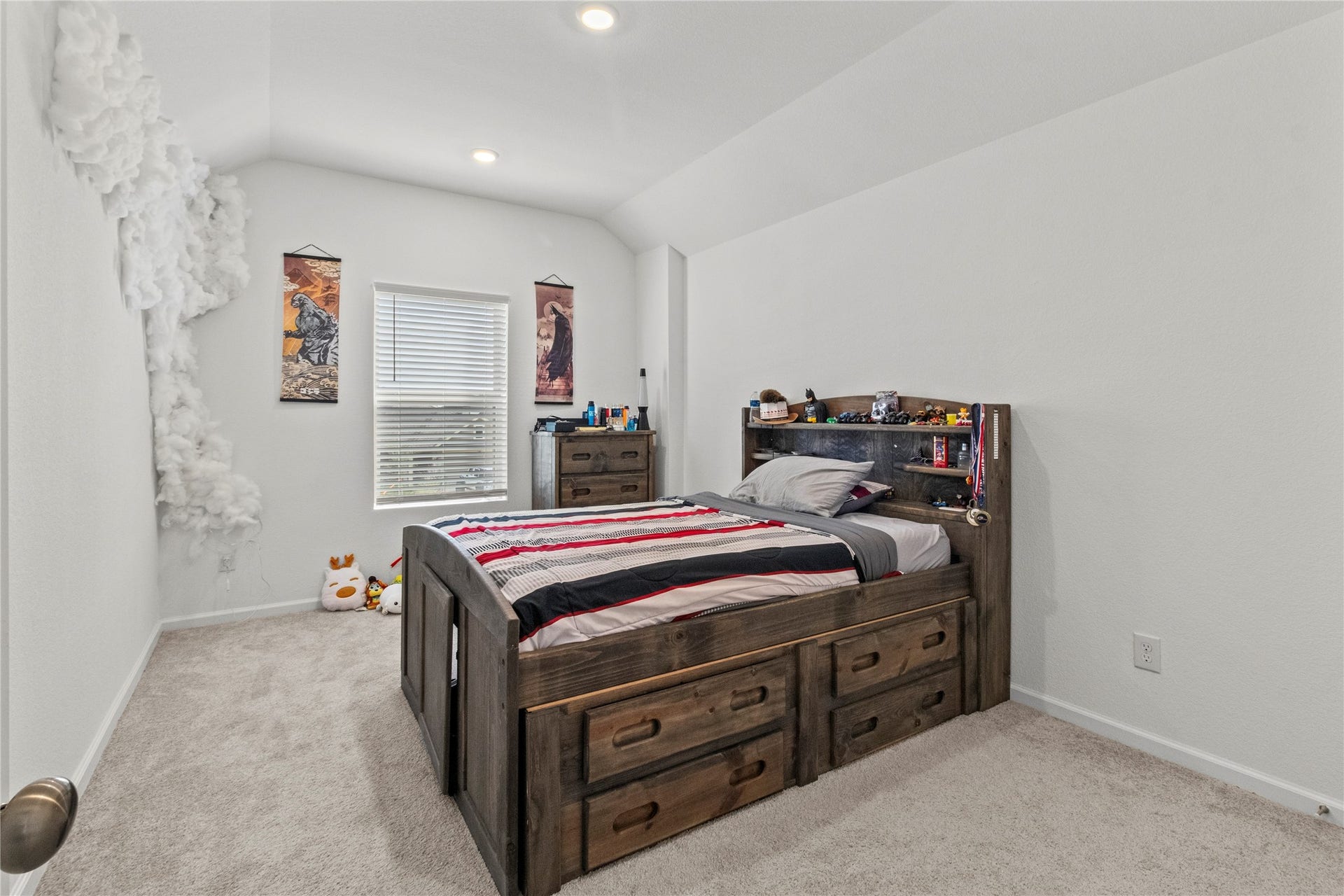2909 Ballast Green Drive, La Marque, TX 77568 Cozy bedroom with carpet flooring, and bright natural light from a central window.