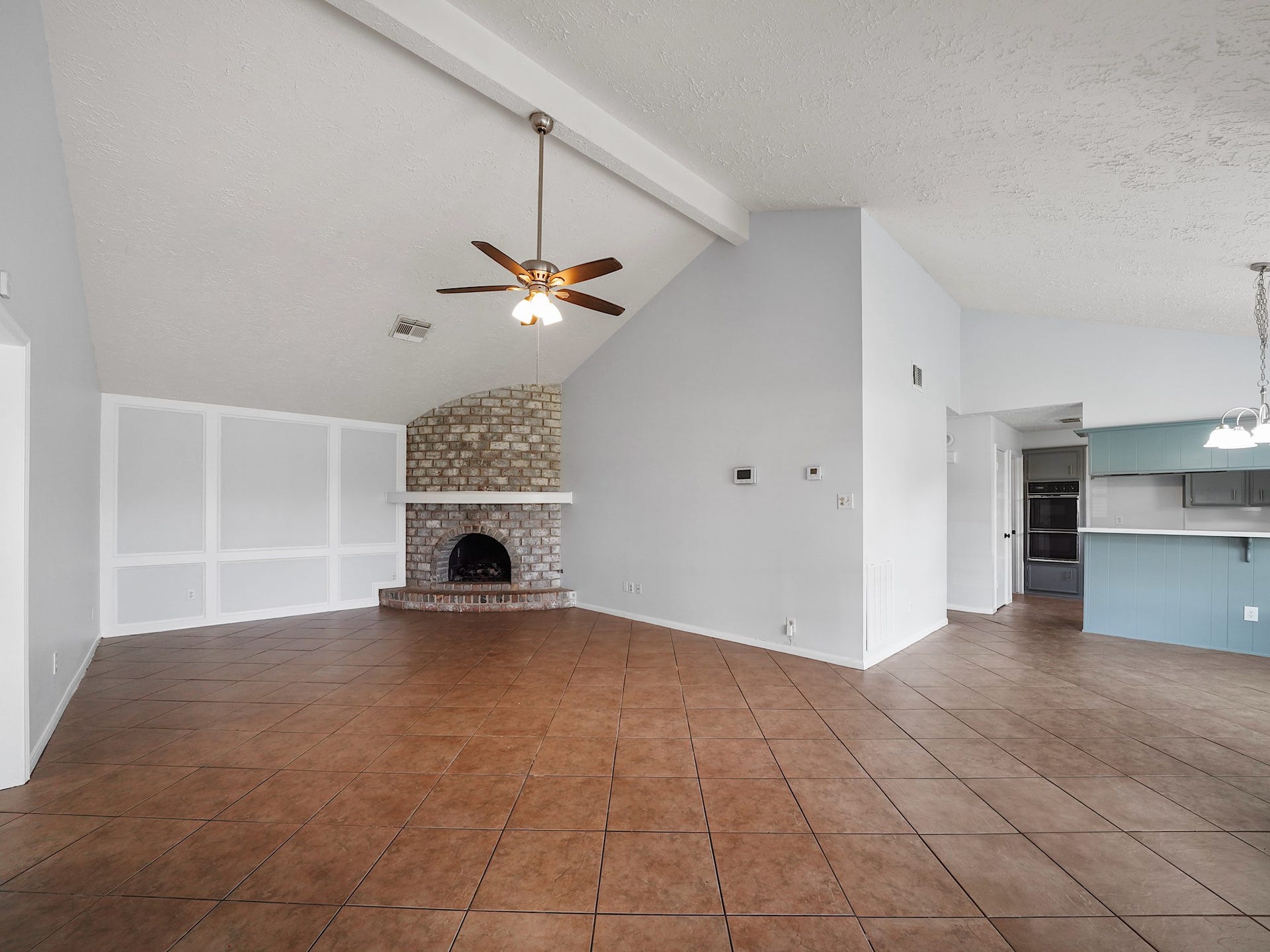 48 Chapparal Court, Missouri City, TX 77459 Living Room with High Ceilings, Tile Floors, Gas Fireplace, Fresh Paint and Lots of Light.