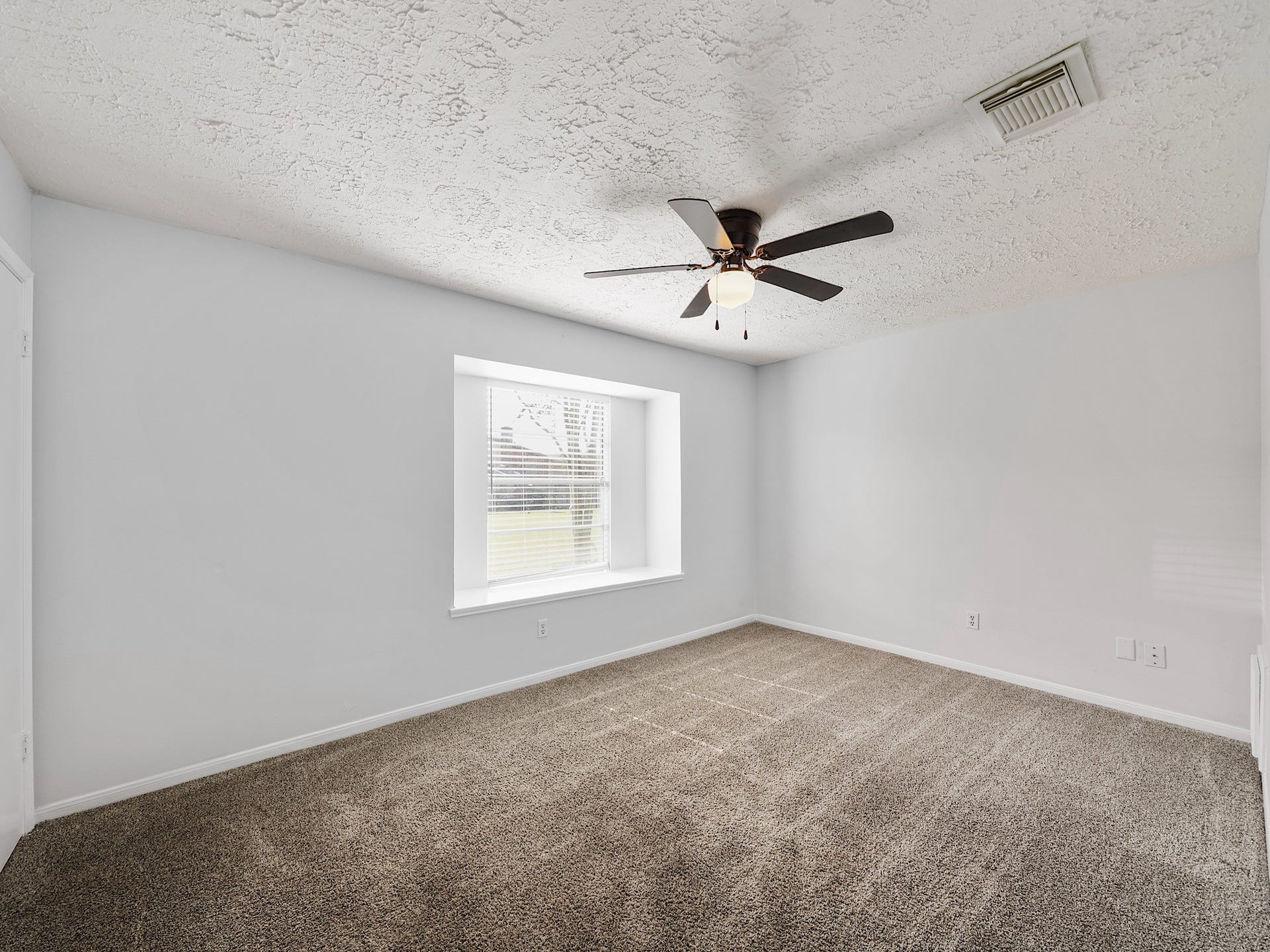 48 Chapparal Court, Missouri City, TX 77459 Bedroom with fresh paint, natural light and steam cleaned carpets.