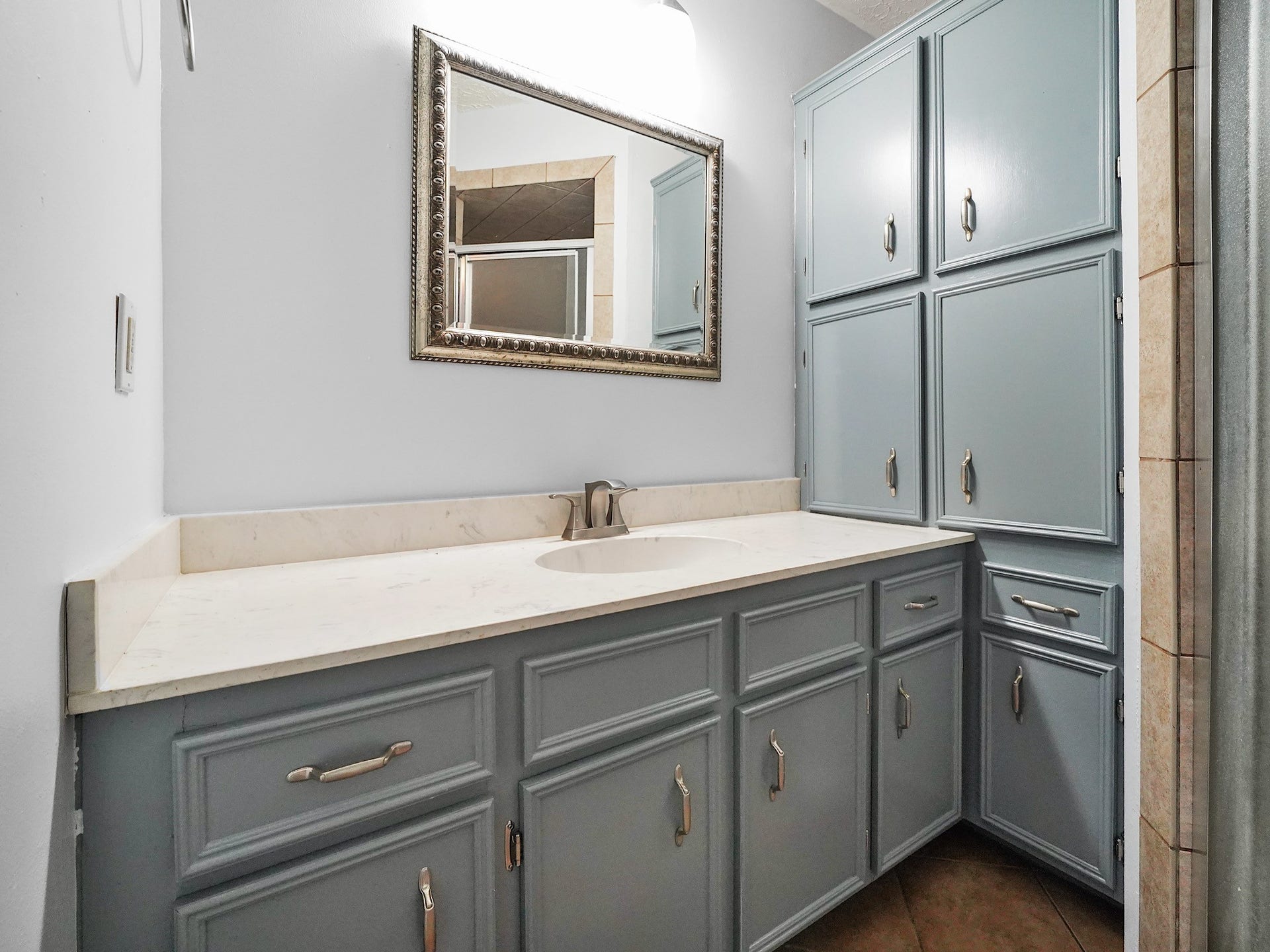 48 Chapparal Court, Missouri City, TX 77459 Freshly painted cabinets in the master bathroom.