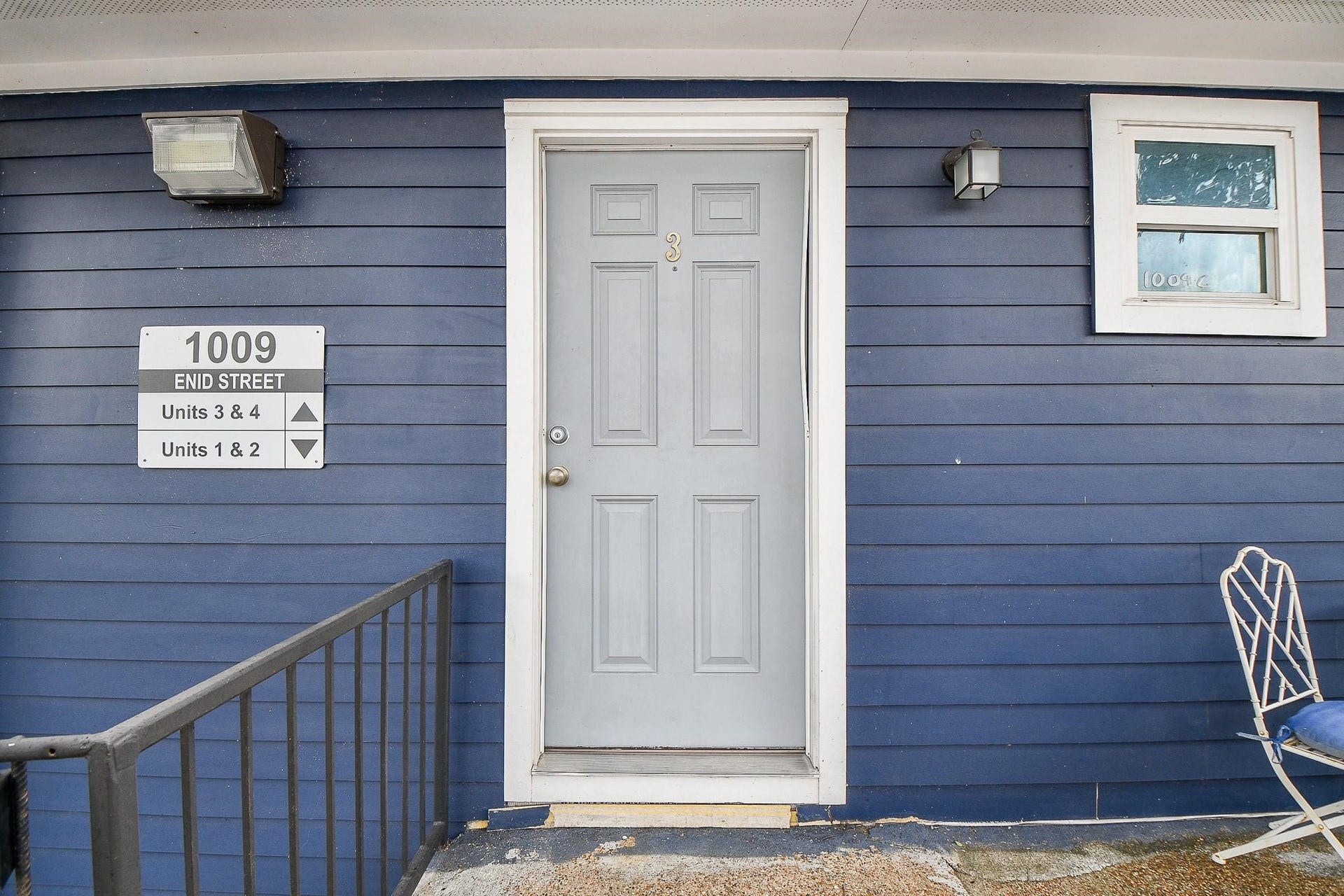 Upstairs 1-bedroom, 1-bathroom unit with private balcony.