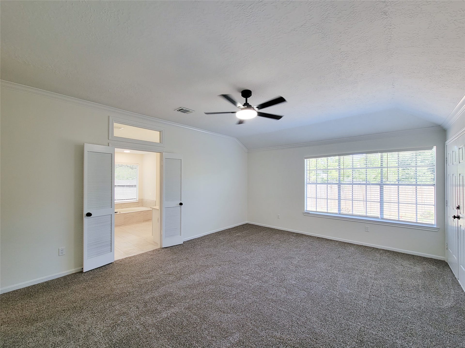 1422 Mabry Mill Road, Houston, TX 77062 spacious primary bedroom with direct access to the backyard and patio