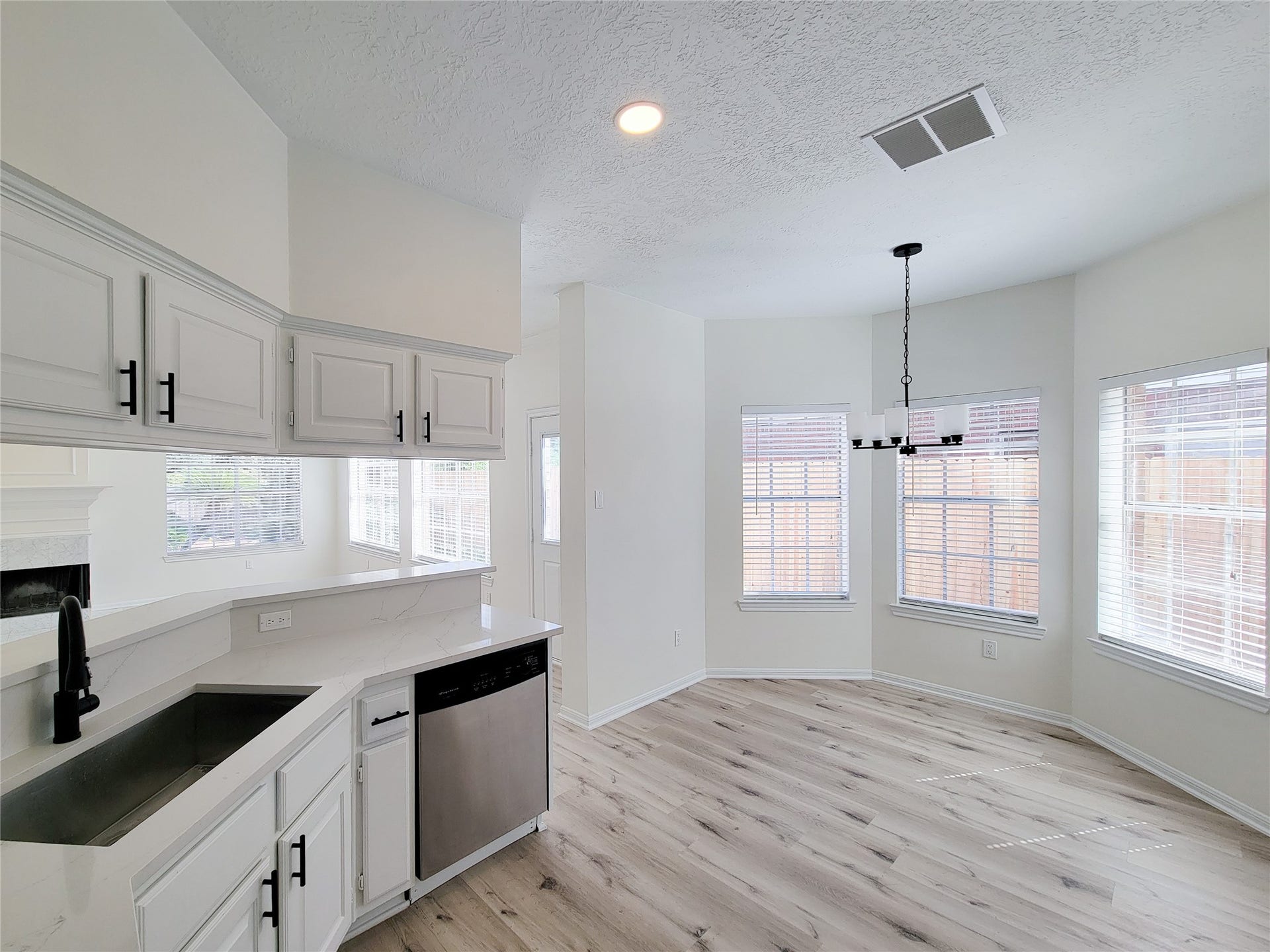 1422 Mabry Mill Road, Houston, TX 77062 the remodeled kitchen with luxurious quartz counter and backsplash