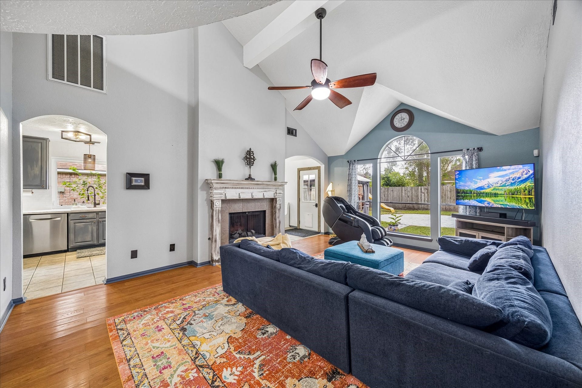 1918 Mercoal Drive, Spring, TX 77386 The living room, fireplace, view of backyard & easy kitchen access