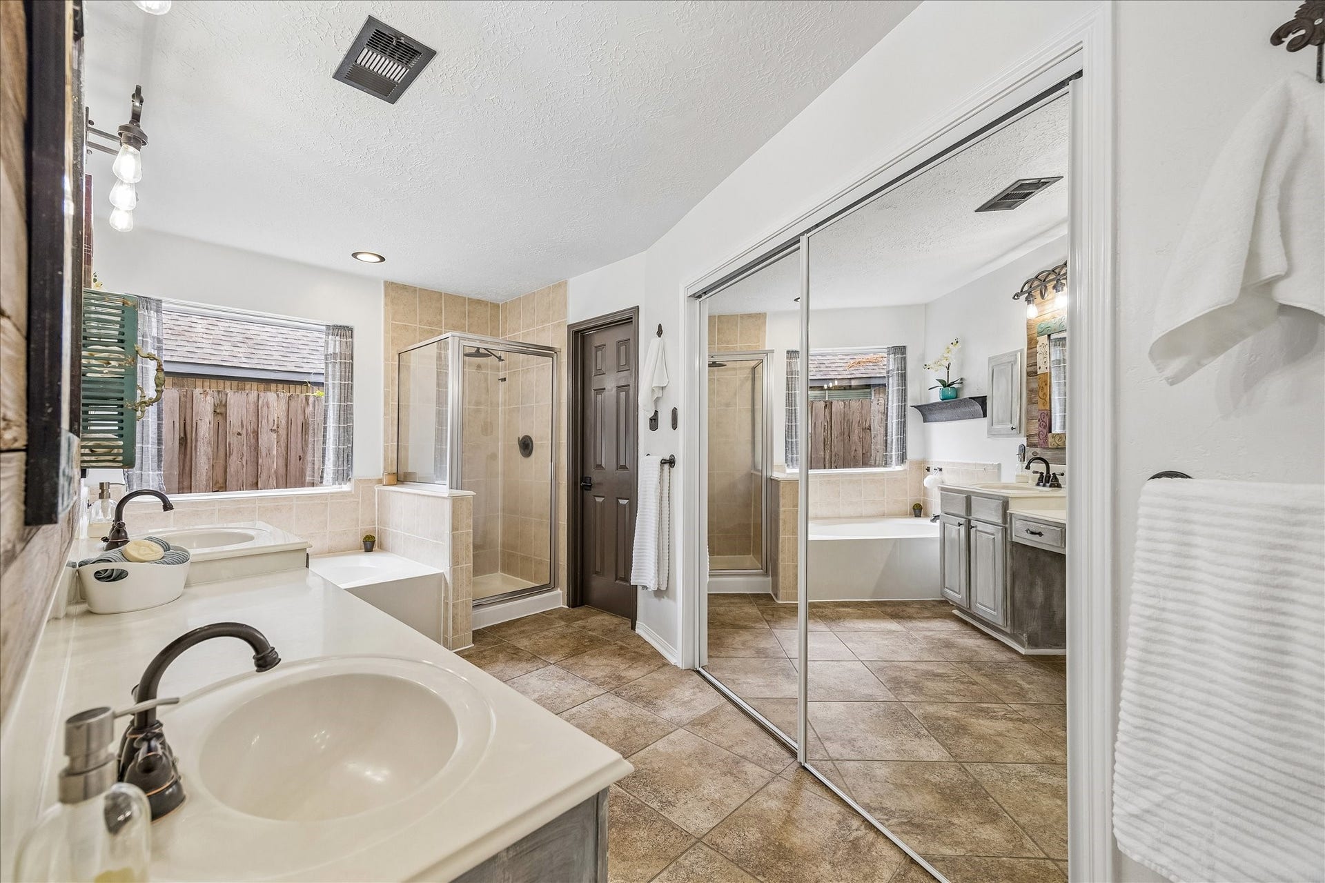 1918 Mercoal Drive, Spring, TX 77386 Large primary bathroom with jetted tub, separate bath/shower & toilet has a door.