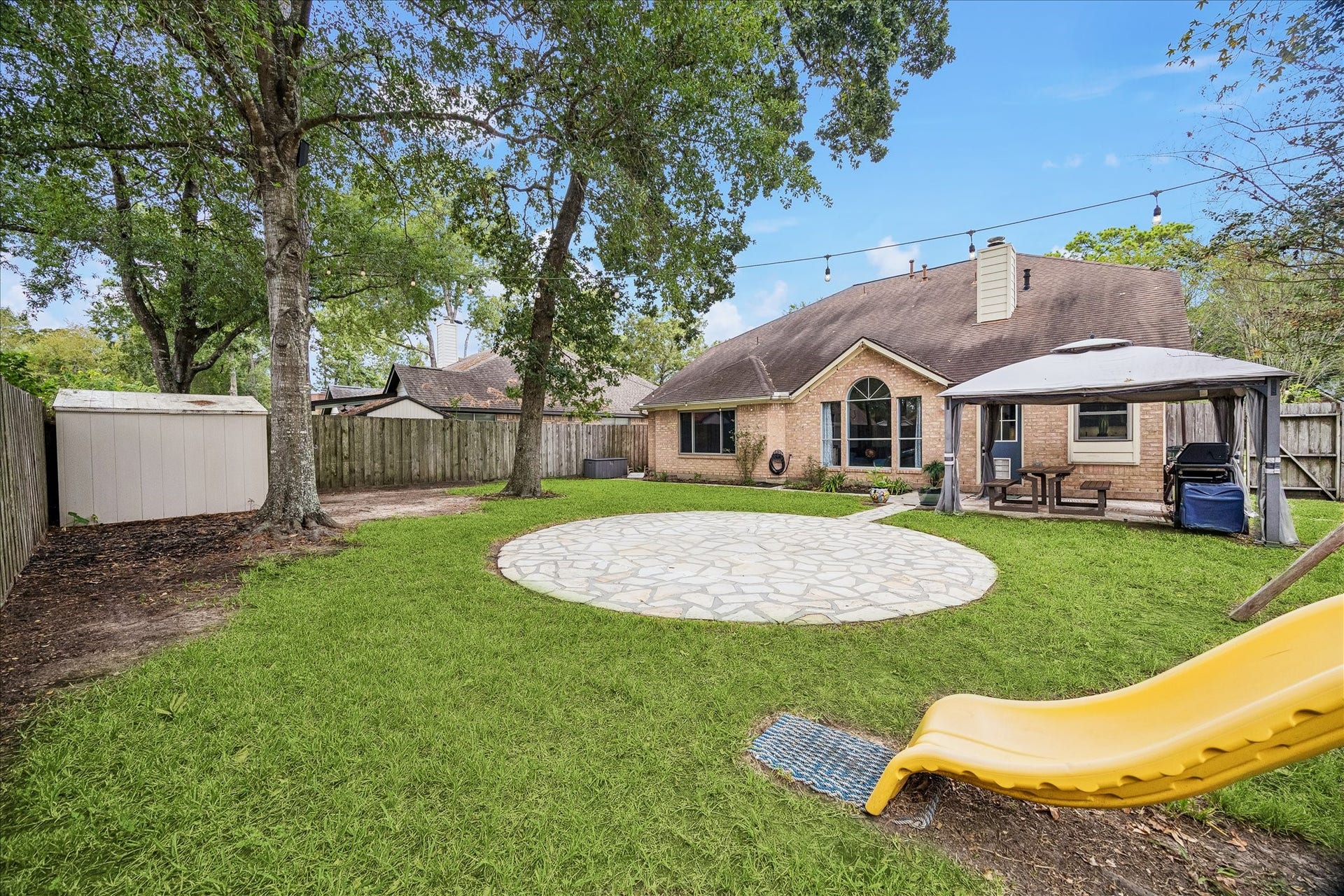 1918 Mercoal Drive, Spring, TX 77386 Storage shed and swing/slide set, gazebo & paver area