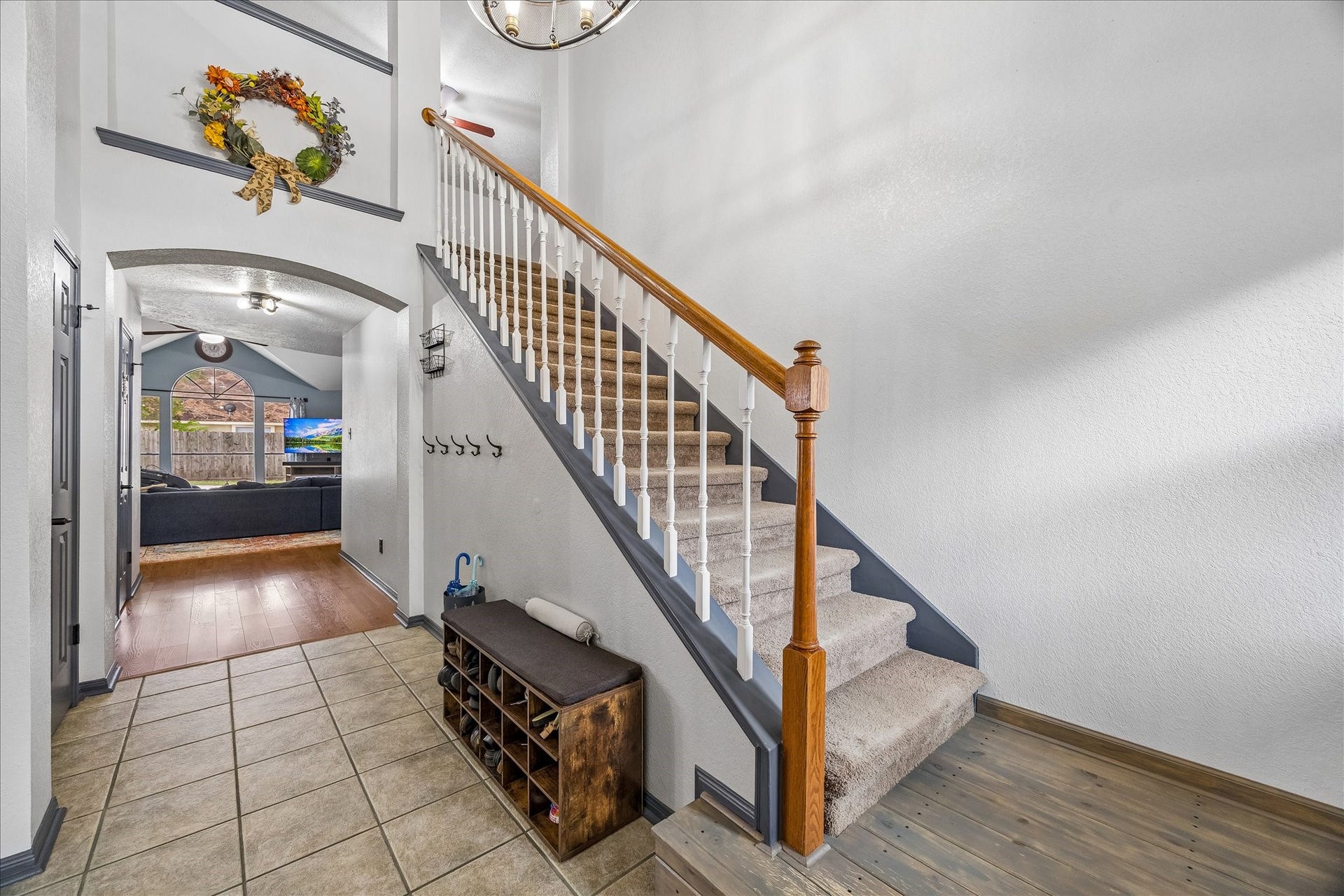 1918 Mercoal Drive, Spring, TX 77386 The floor, stairs w/landing, curved arched high doorway