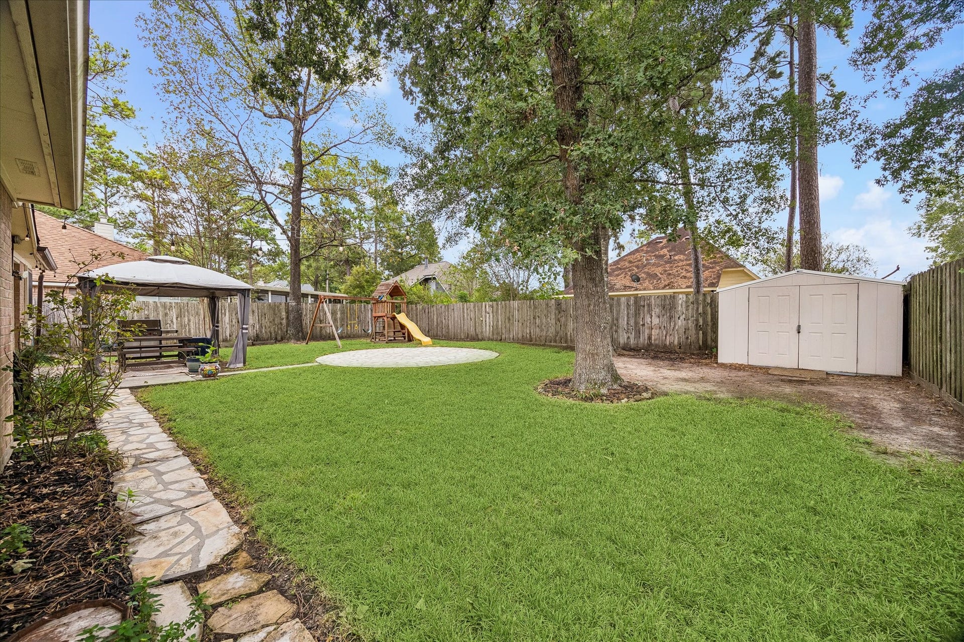 1918 Mercoal Drive, Spring, TX 77386 The backyard is well cared for