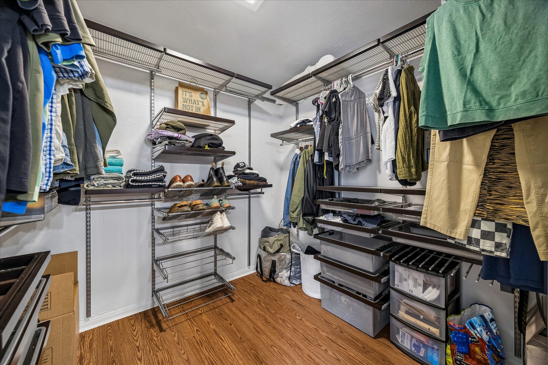 1918 Mercoal Drive, Spring, TX 77386 Look at this large primary closet with lots of options & beautiful floors, floor to ceiling sliding mirrored doors